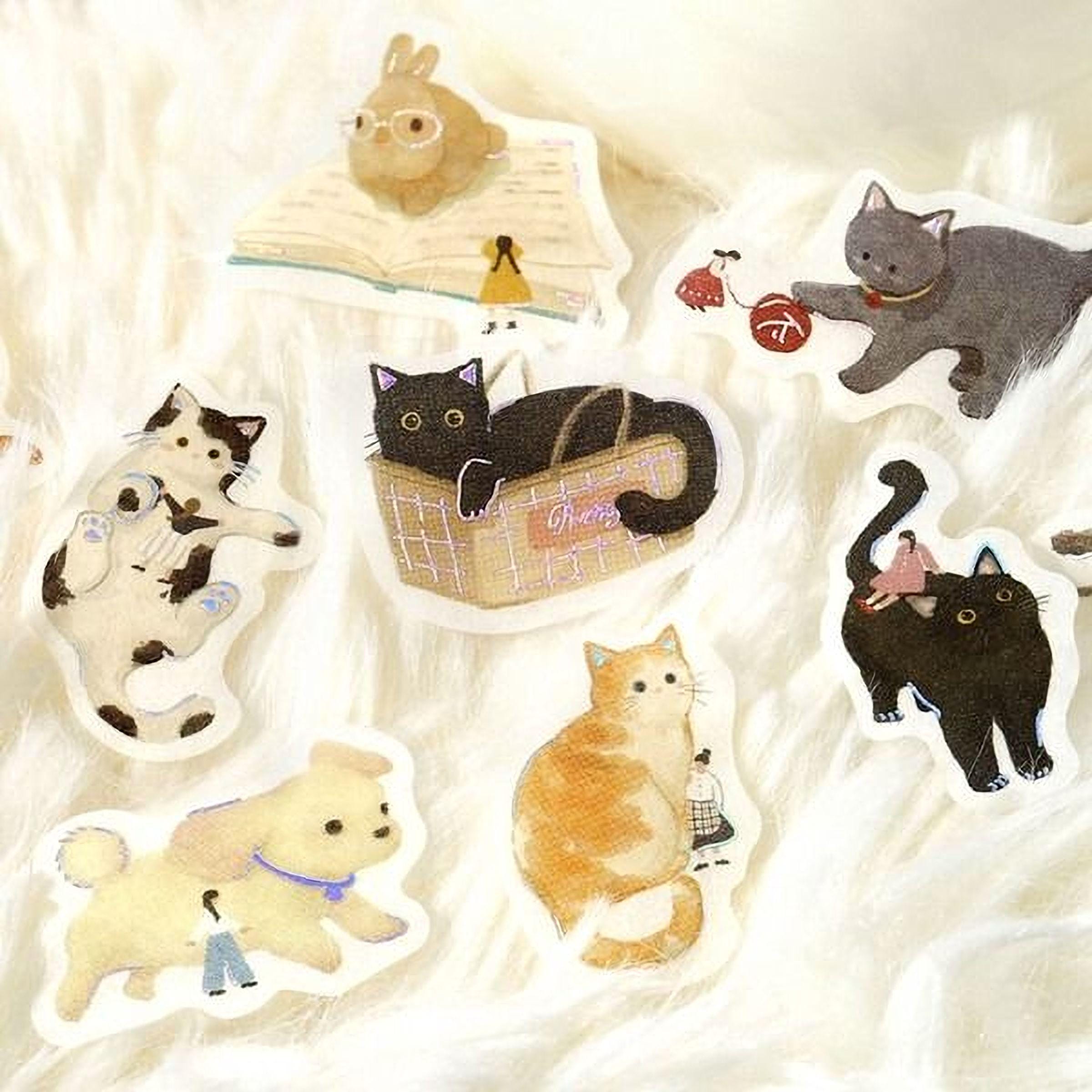 a collection of stickers featuring various cartoon animal characters, including cats, dogs, and a rabbit.
