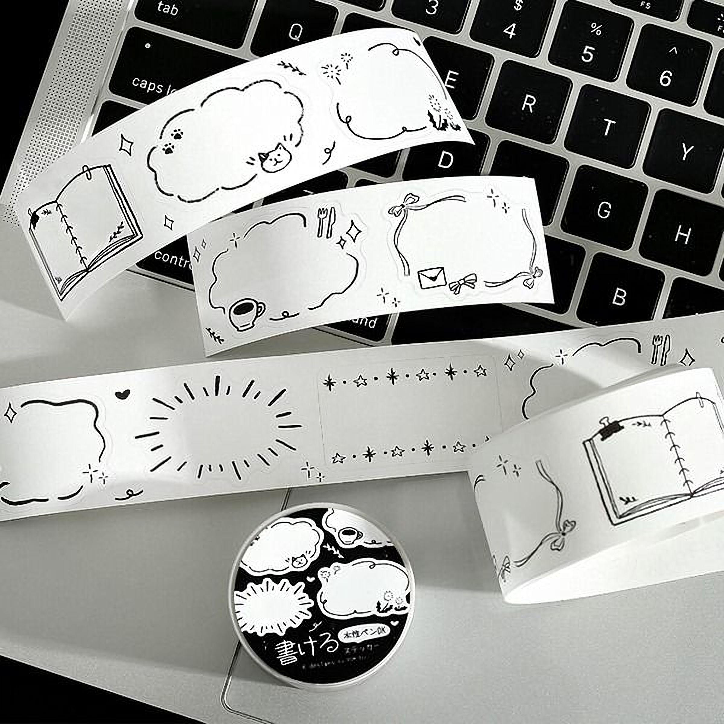 a collection of various doodle stickers and a round object with Japanese text on it, all placed on a computer keyboard.