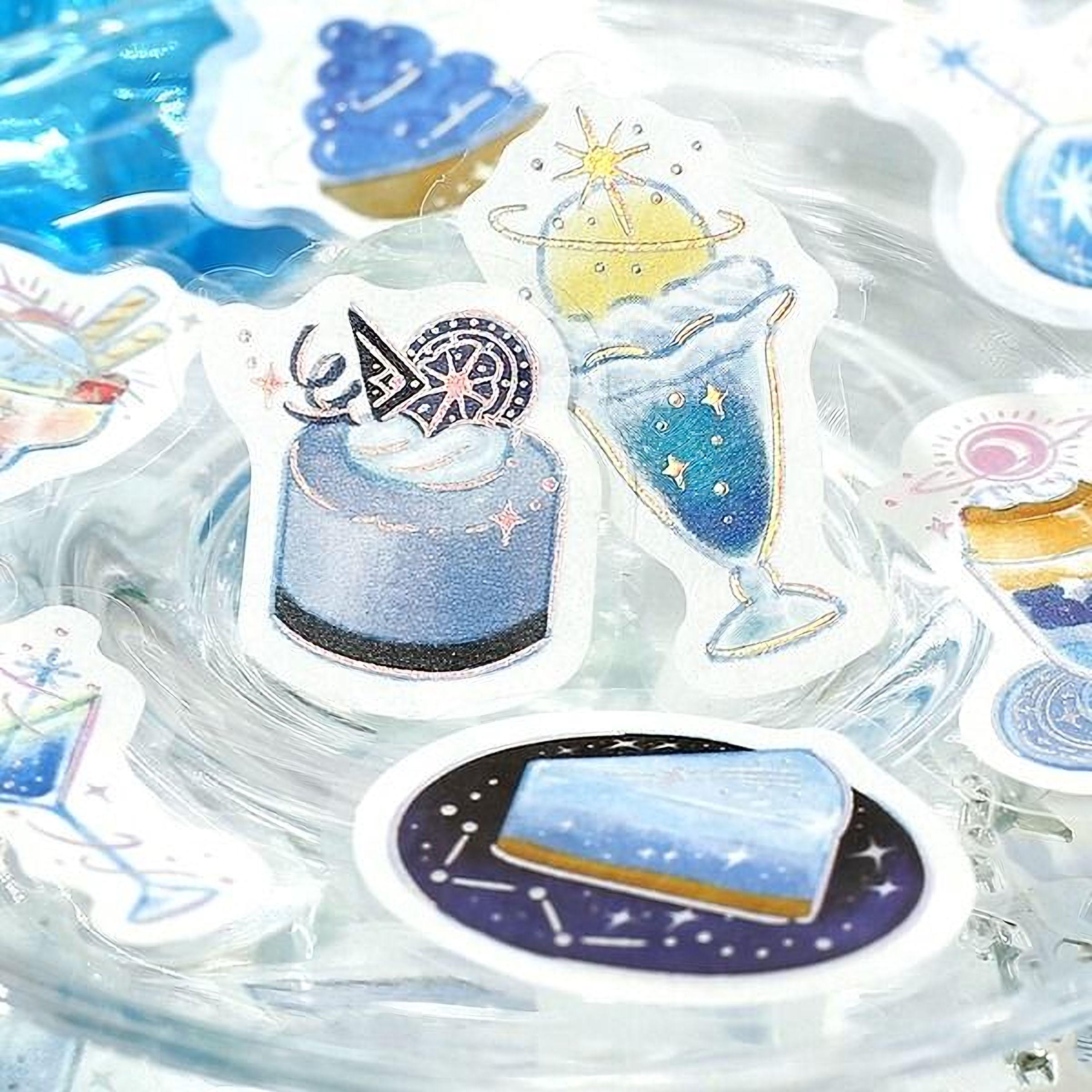 a collection of colorful stickers featuring various desserts and drinks, including a cake, ice cream, and a milkshake, all adorned with stars and other decorative elements.