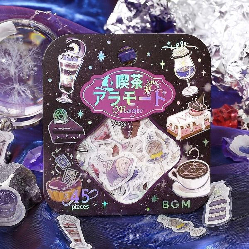 a package of stickers with various whimsical and fantastical designs, including a cupcake, a cake, and a crystal ball.