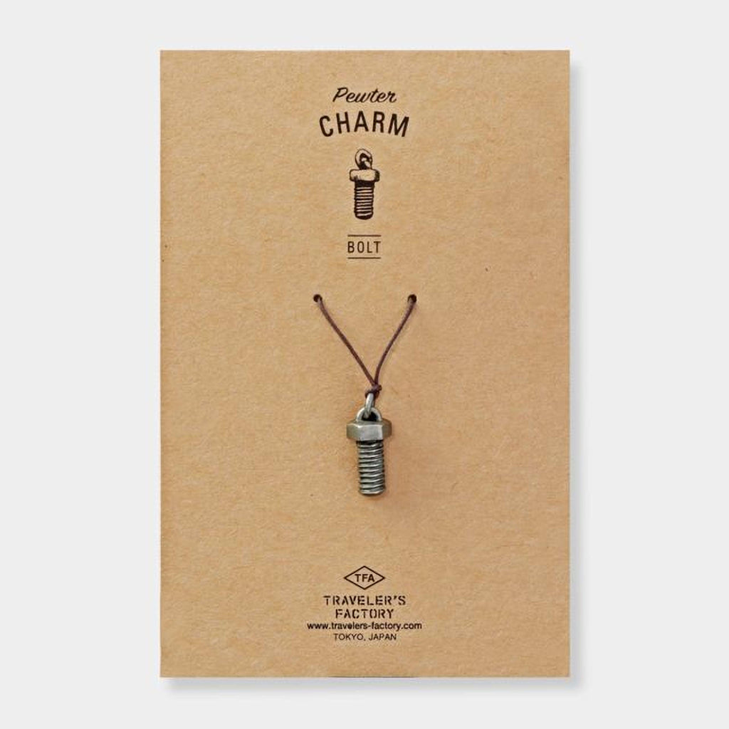 A pendant made of a small metal bolt is shown on a brown cardboard background.