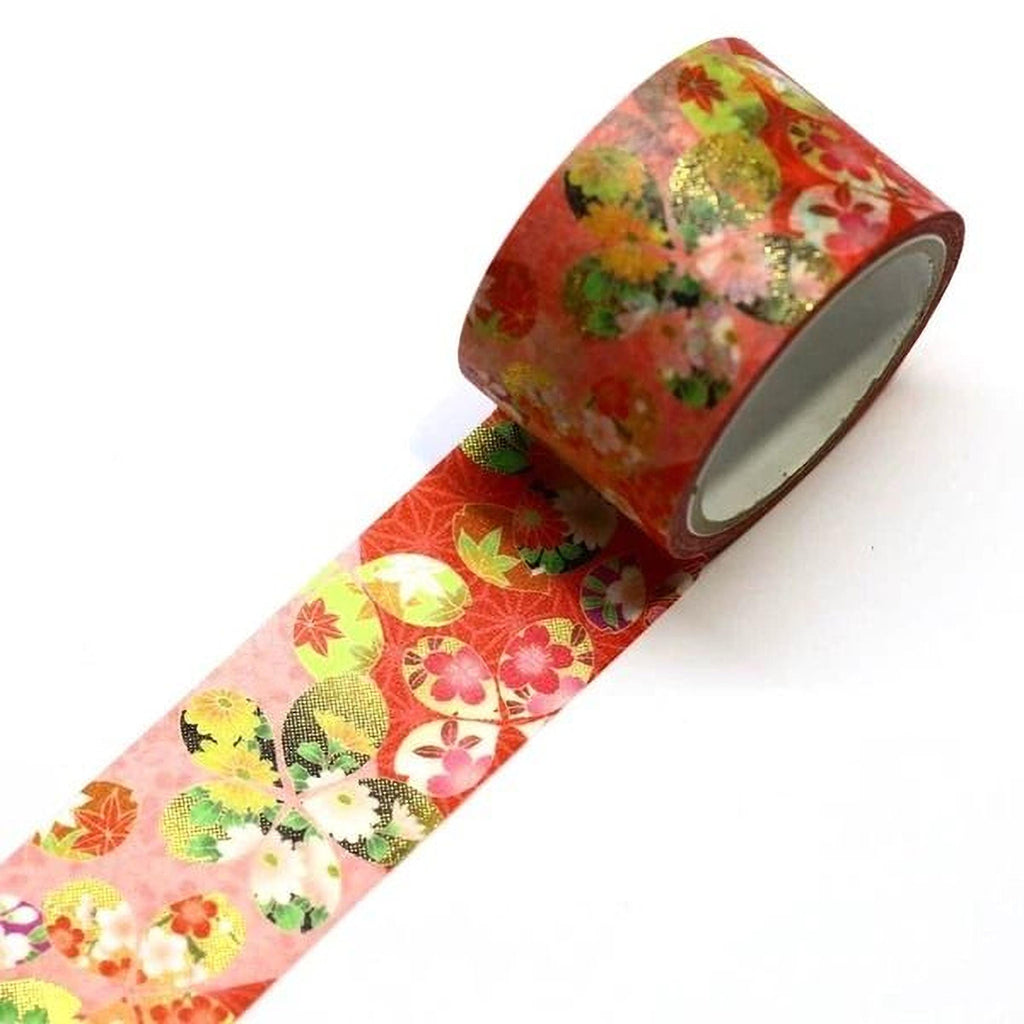 A roll of red and green floral patterned tape is shown against a white background.