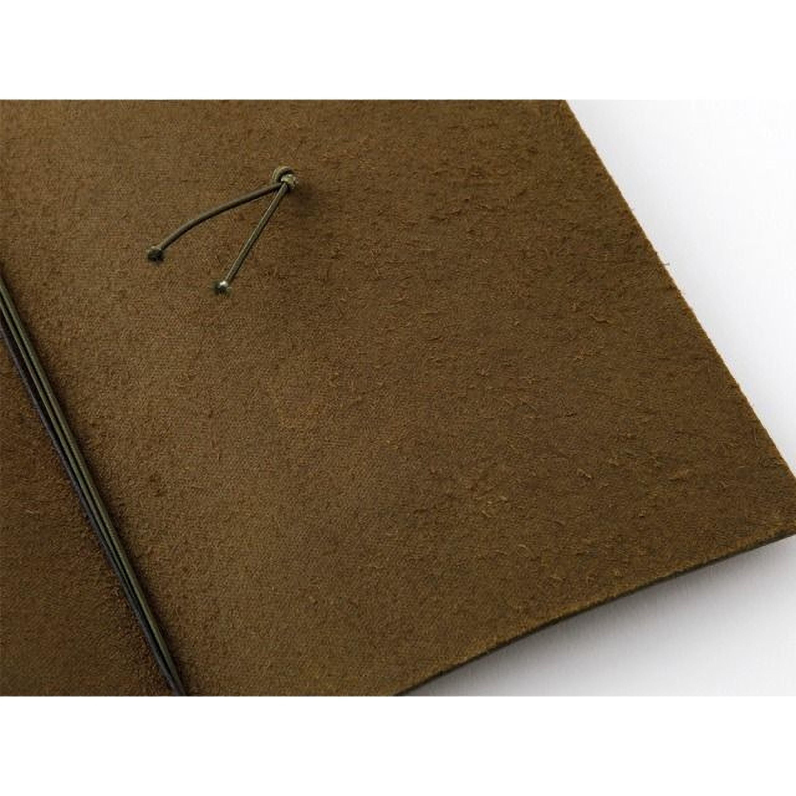 a close-up view of a brown, textured surface, possibly a piece of leather or fabric.