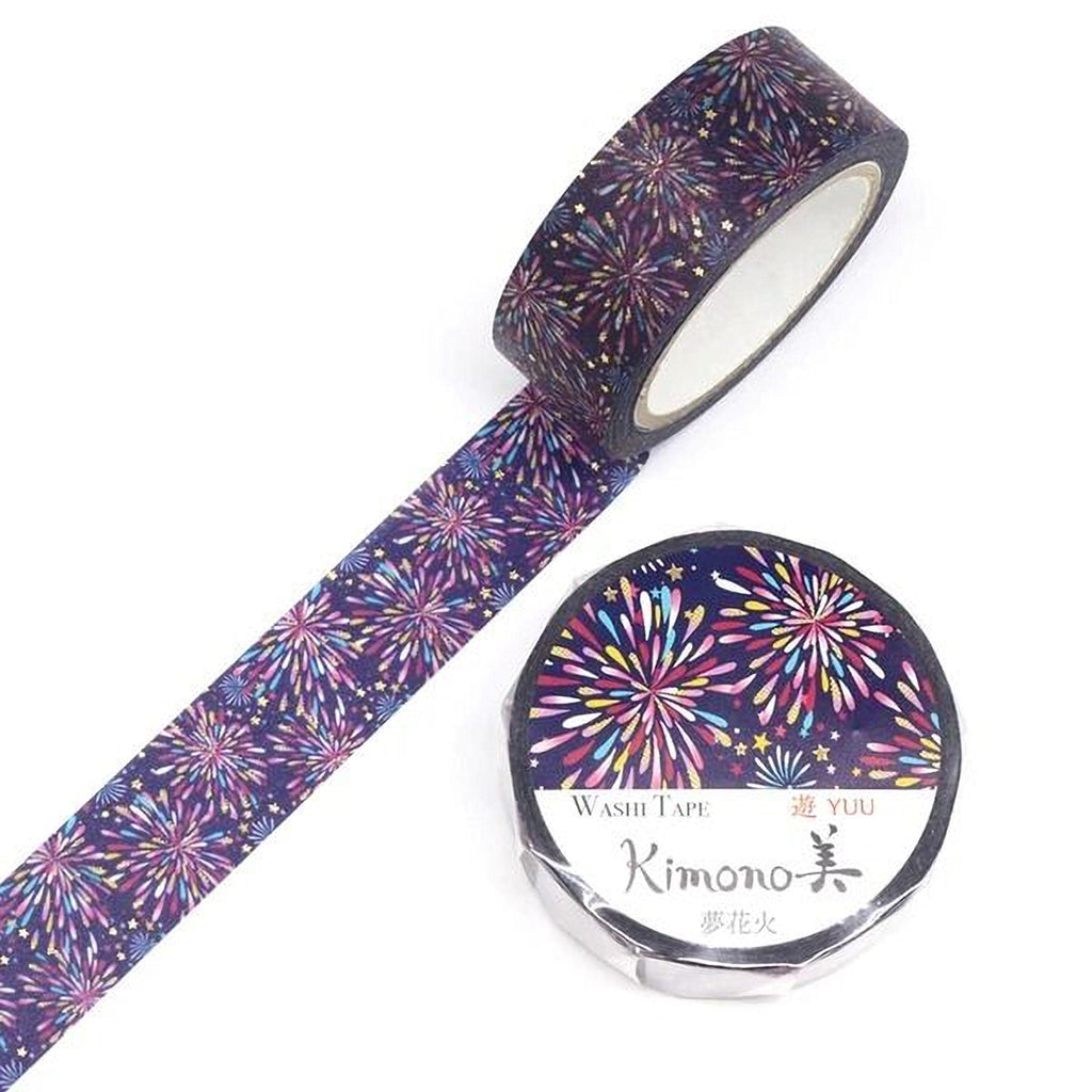 a roll of washi tape with a vibrant, colorful fireworks pattern on it, and a round, white label with Japanese text next to it.