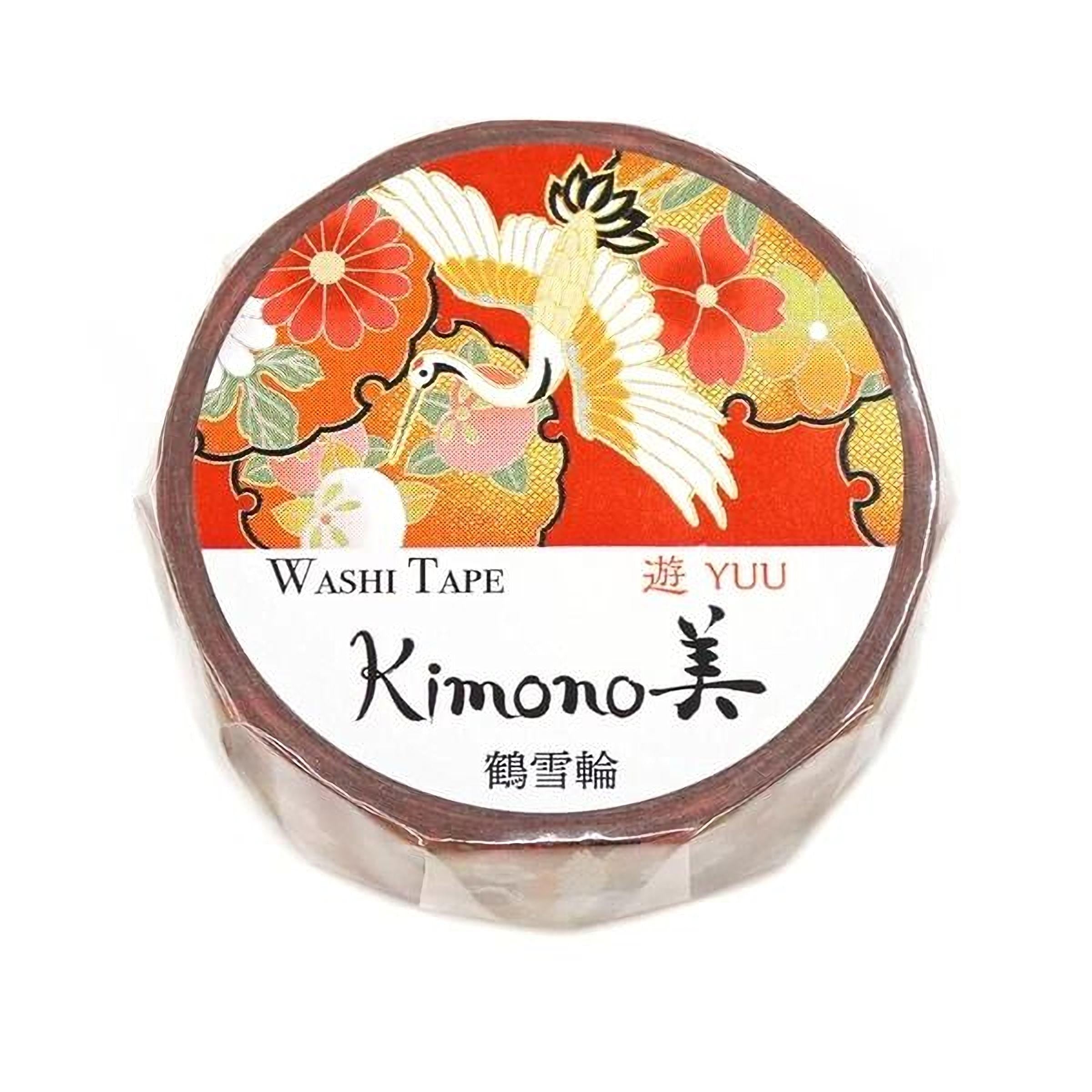 A round, brown, and white circular object with a floral design and a bird in flight. The text on the object includes "Washi Tape", "YU", and "Kimono".