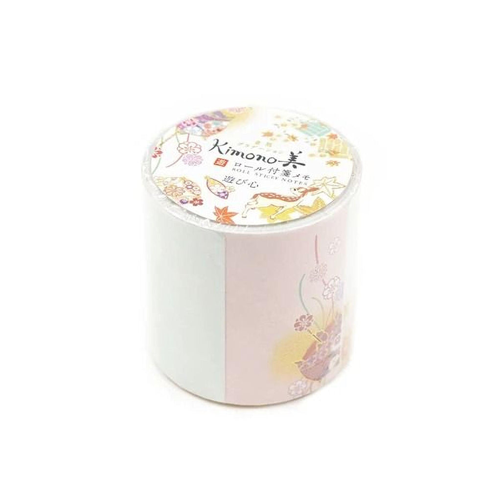 A cylindrical container with a white and pink floral design on it, featuring a label with Japanese text.