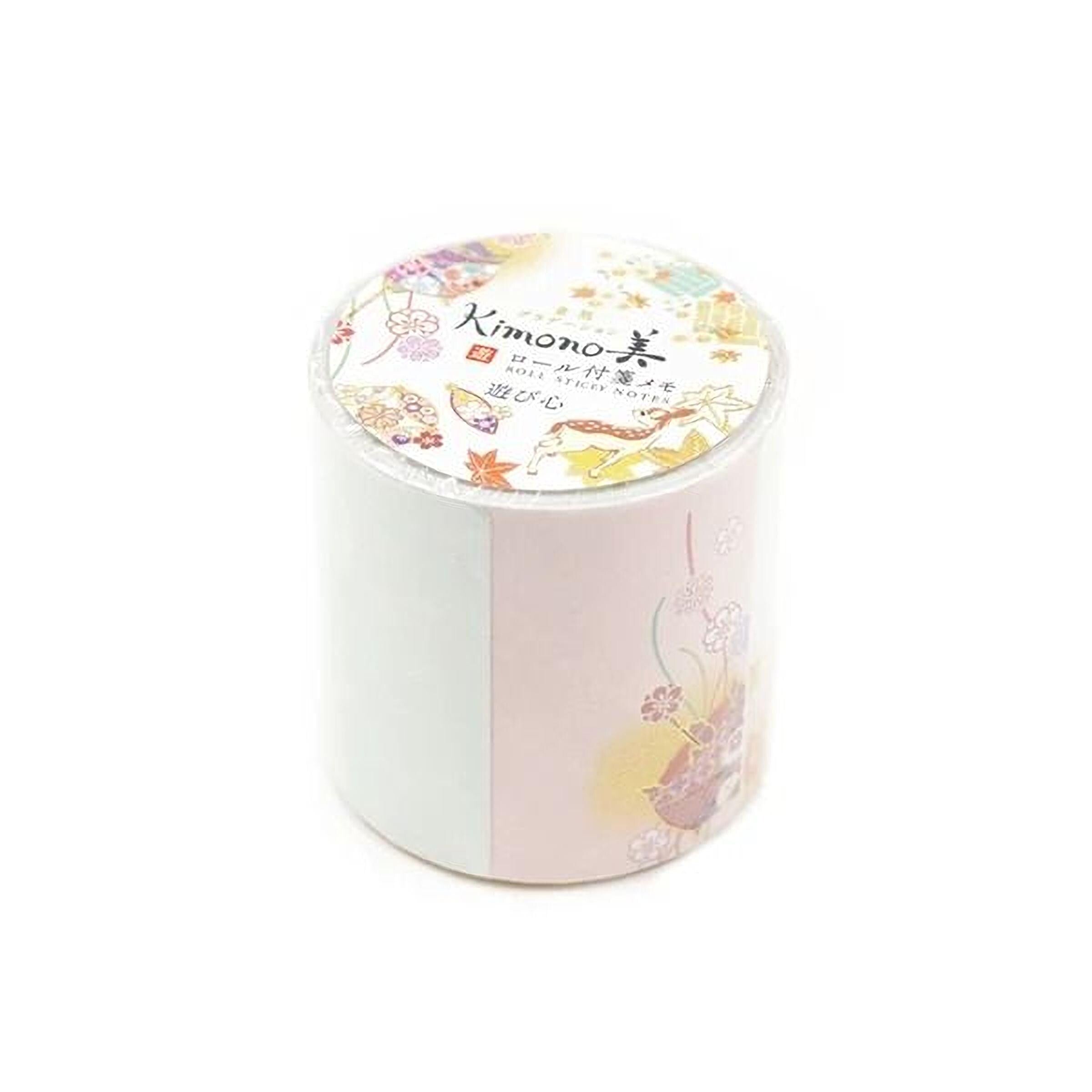 A cylindrical container with a white and pink floral design on it, featuring a label with Japanese text.