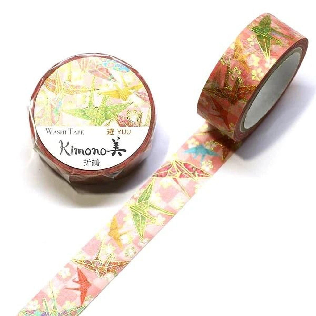a roll of washi tape with a pink and green floral pattern, and a second roll of washi tape with a similar pattern.