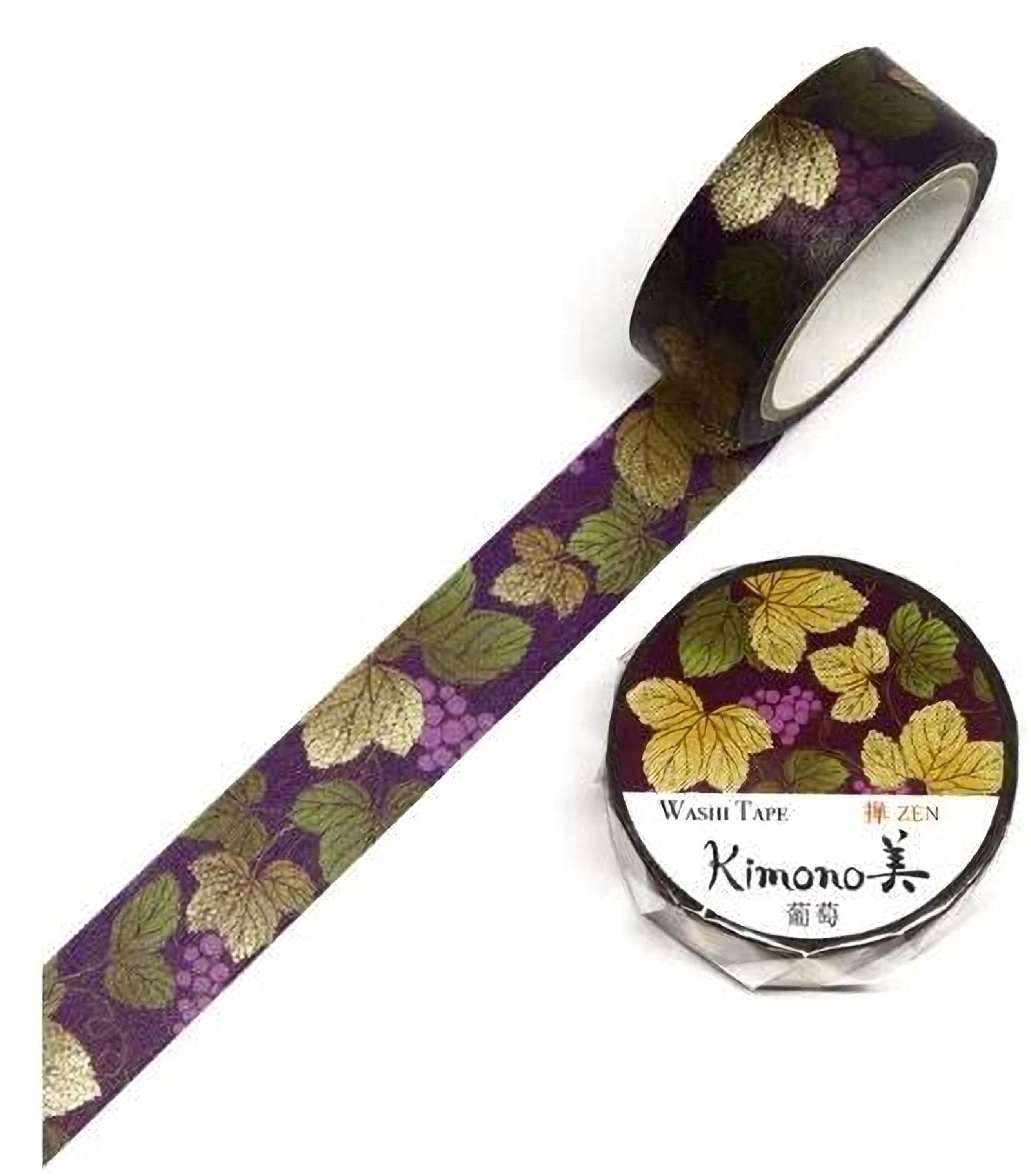 a roll of washi tape with a purple and green leaf pattern, and a round container with a label that reads "Kimono" and "Washi Tape" printed on it.