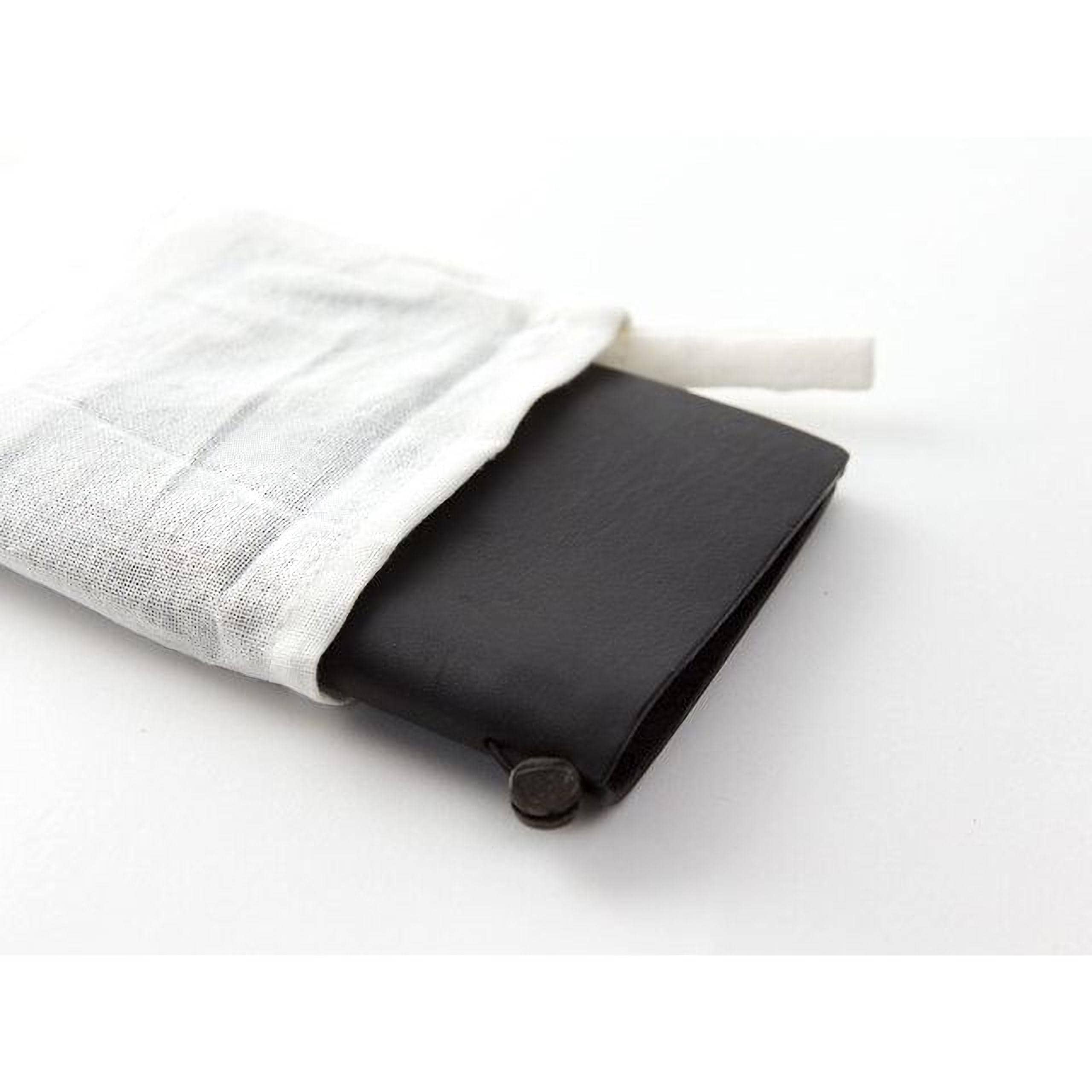A black leather wallet is partially open, revealing its contents, which include a white cloth bag.