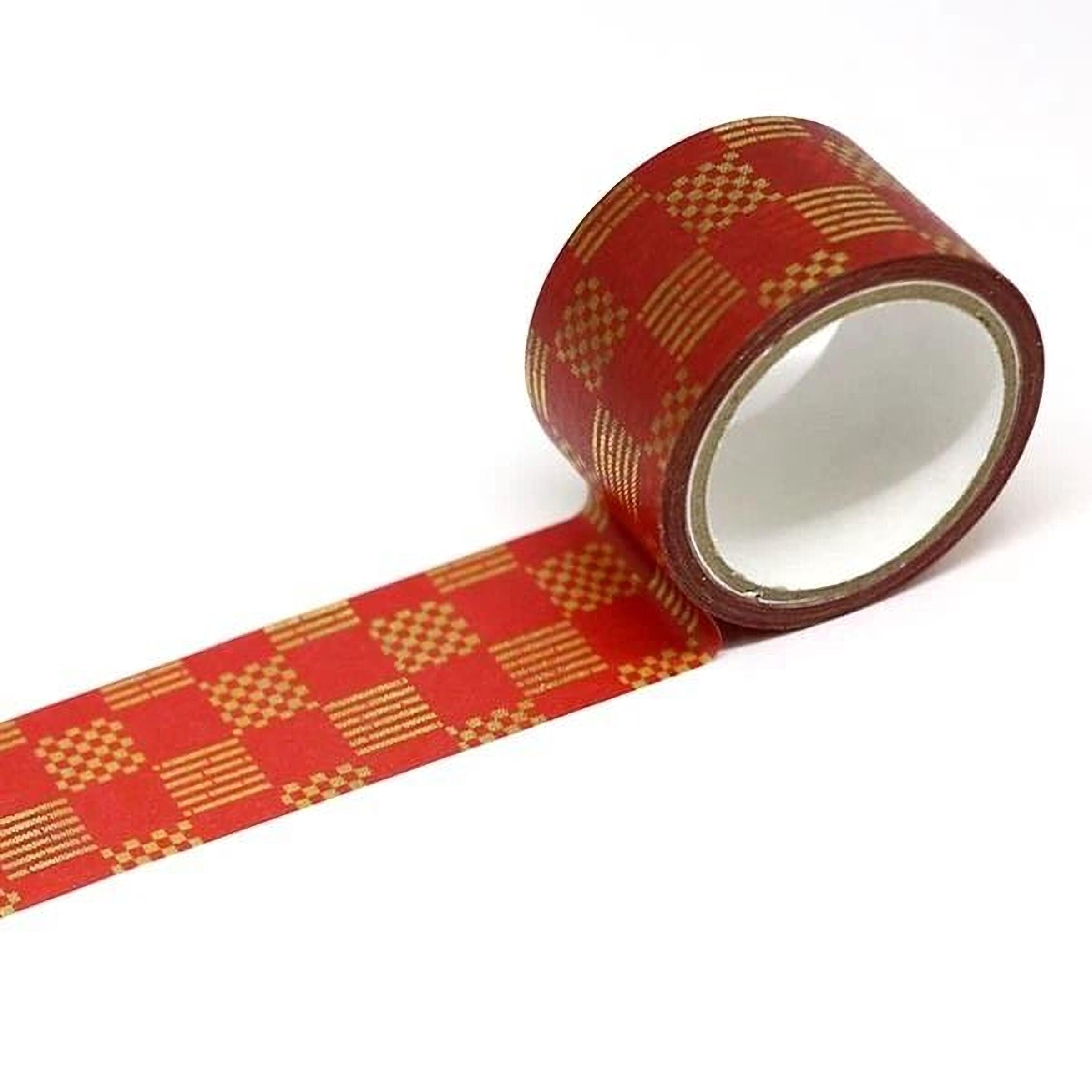 A roll of red and gold checkered pattern tape is shown against a white background.