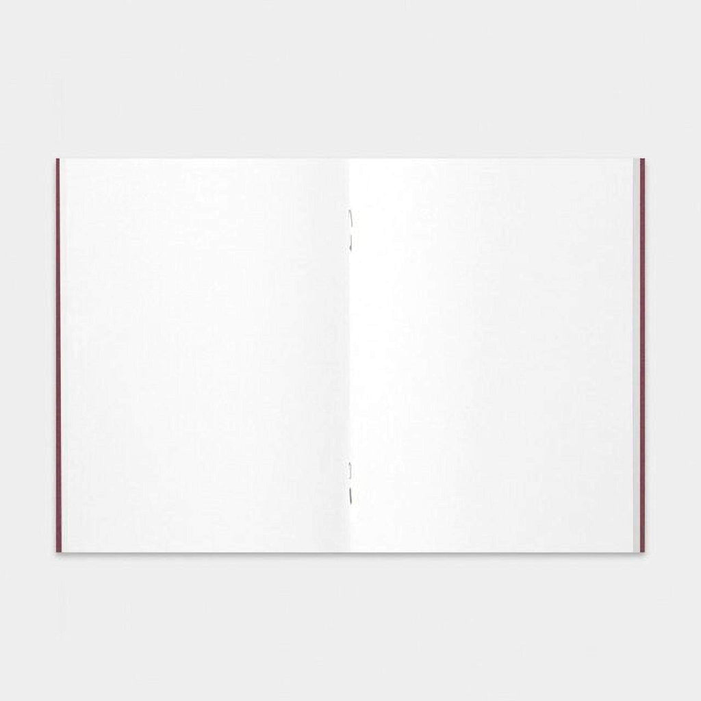The image is a blank, white notebook with a red spine.