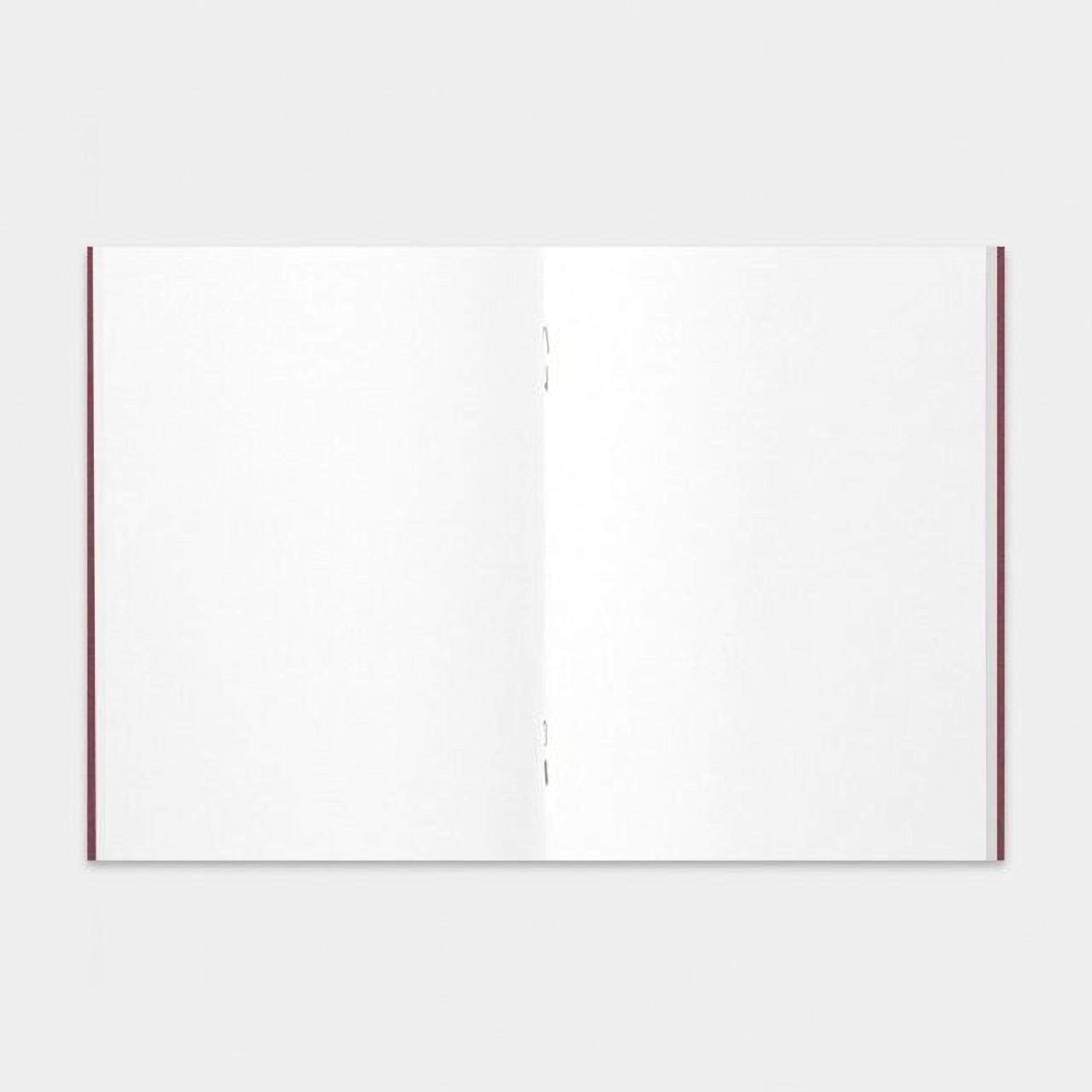 The image is a blank, white notebook with a red spine.