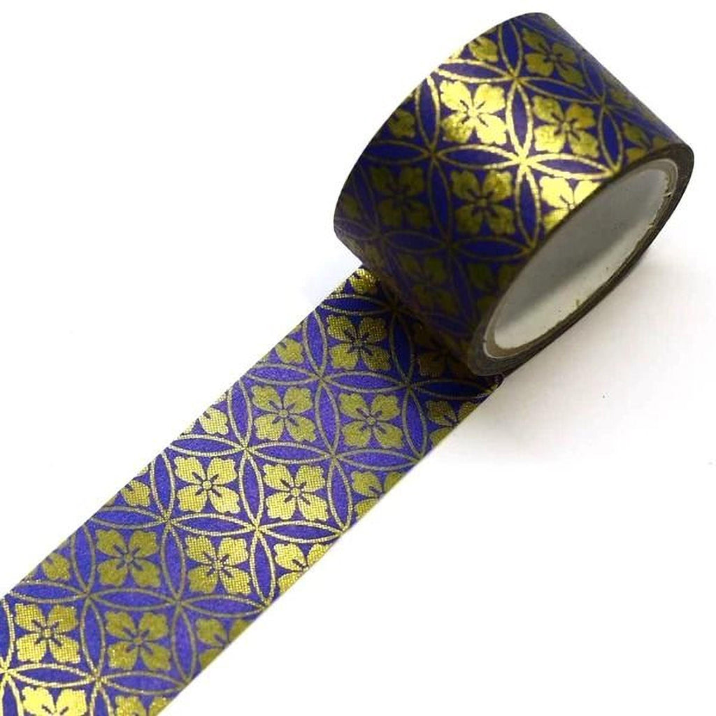 A roll of metallic gold and purple patterned tape with a repeating floral design.