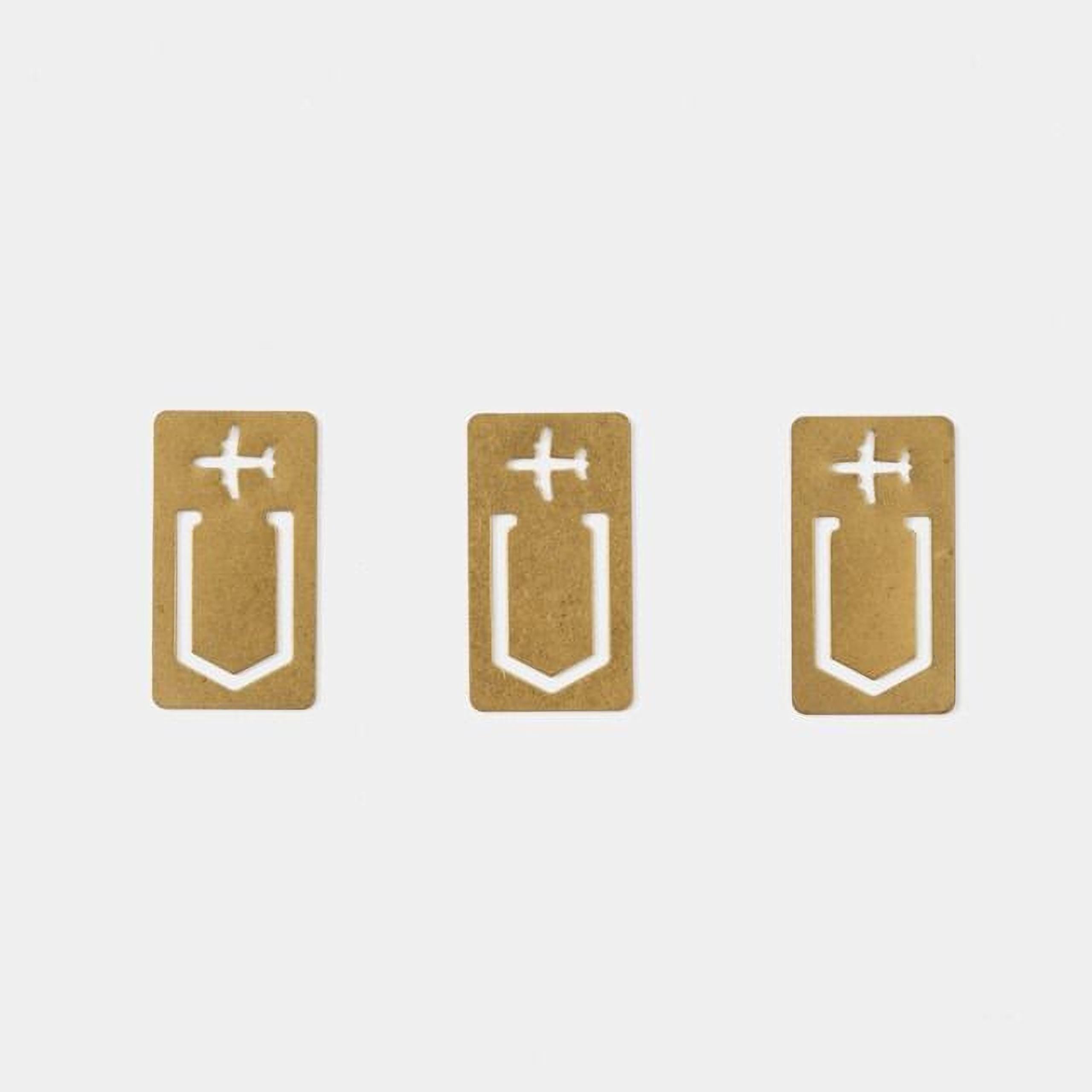 Three identical gold-colored paper clips with white airplane symbols on them.
