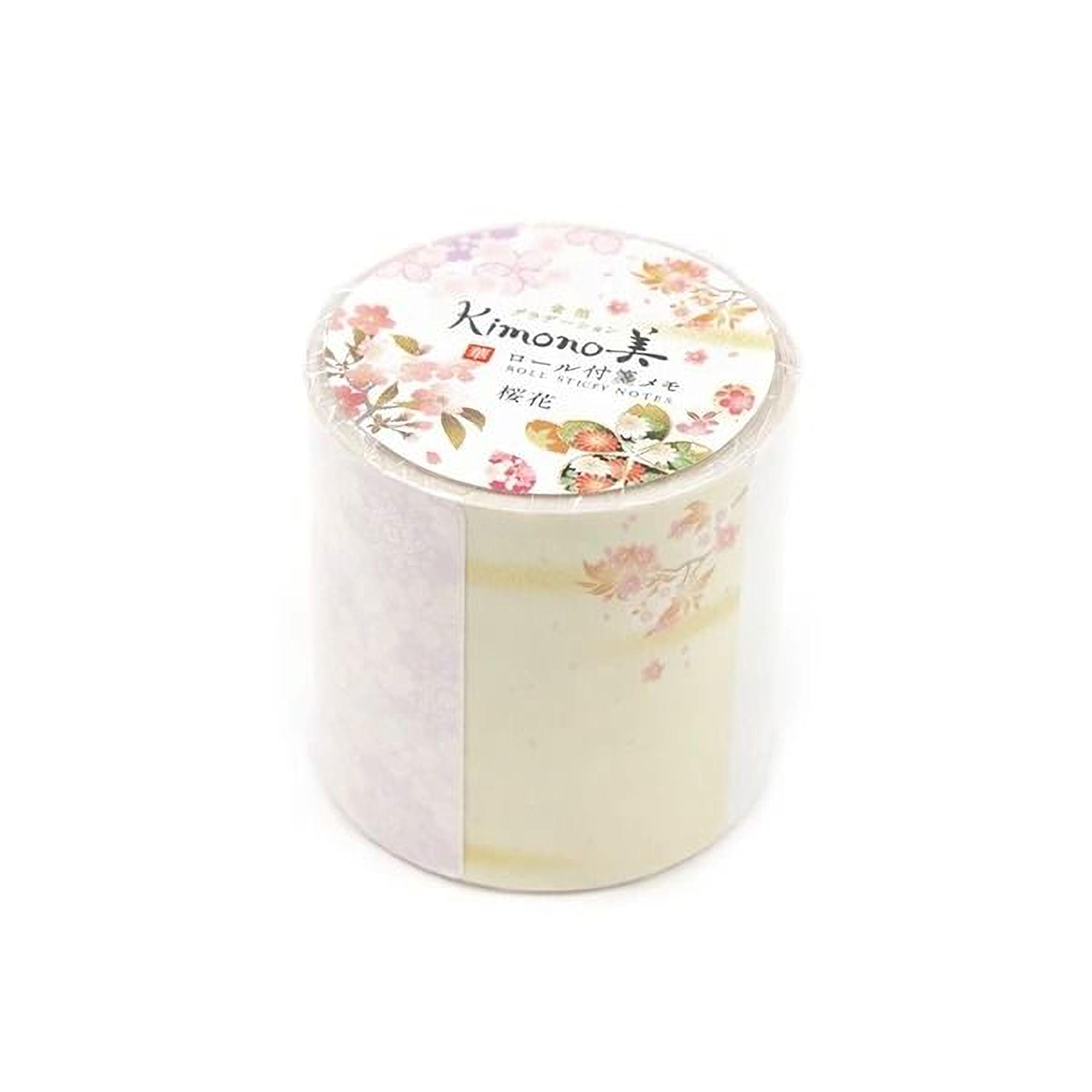 A cylindrical container with a floral pattern on the lid, which appears to be a decorative item.