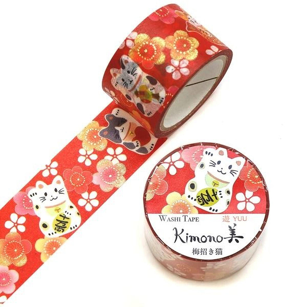 a roll of red and white floral patterned washi tape and a round container of the same tape.