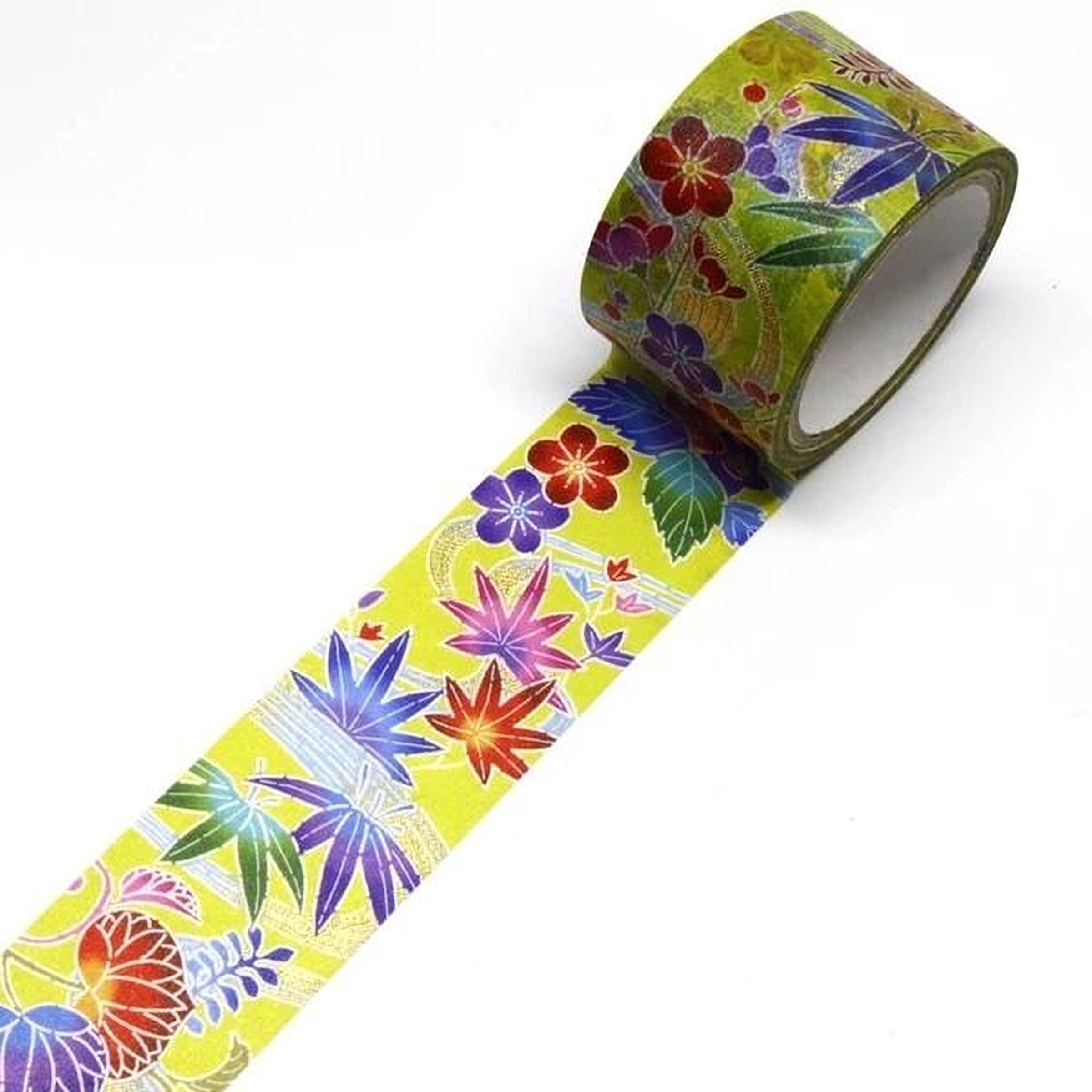 A roll of colorful tape with a floral pattern on it, lying on a white surface.