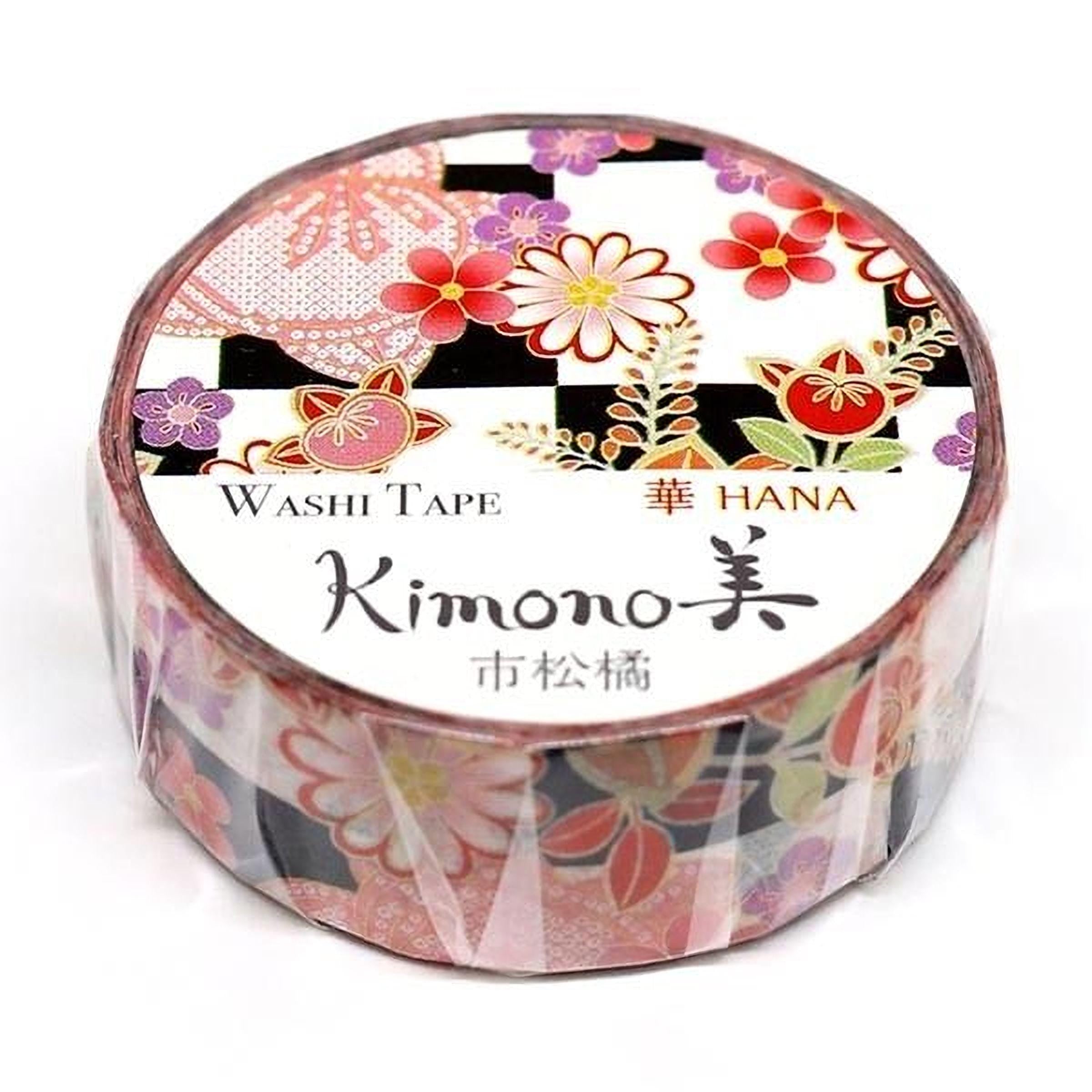 A round container of washi tape with a floral pattern and Japanese text.