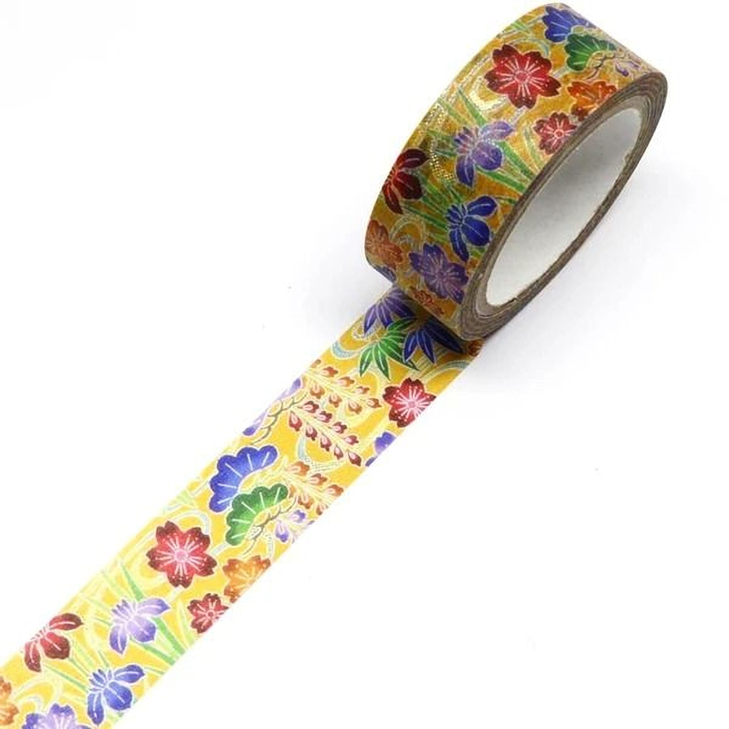 A roll of colorful floral patterned tape is lying on a white surface.