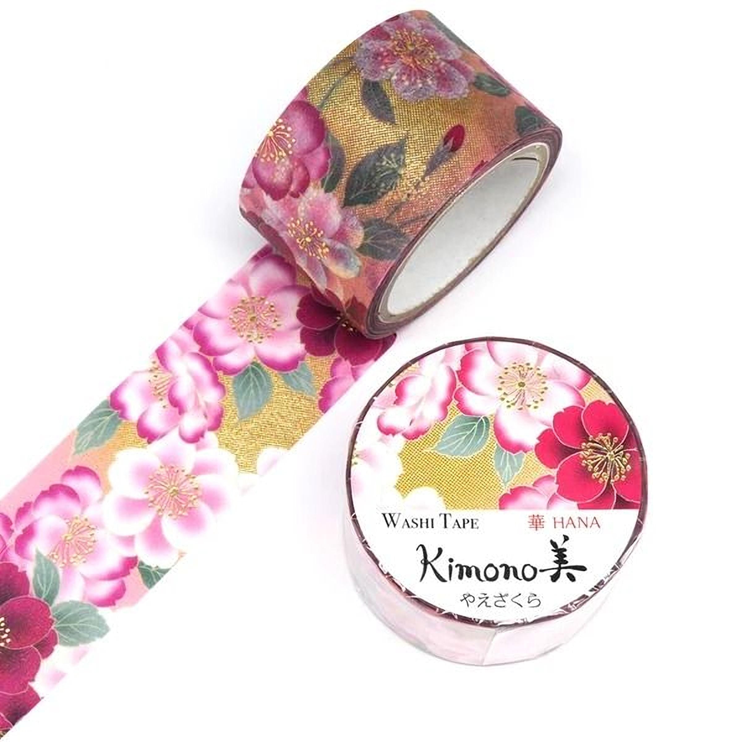 a roll of washable tape with a floral pattern and a round container with Japanese text on it.