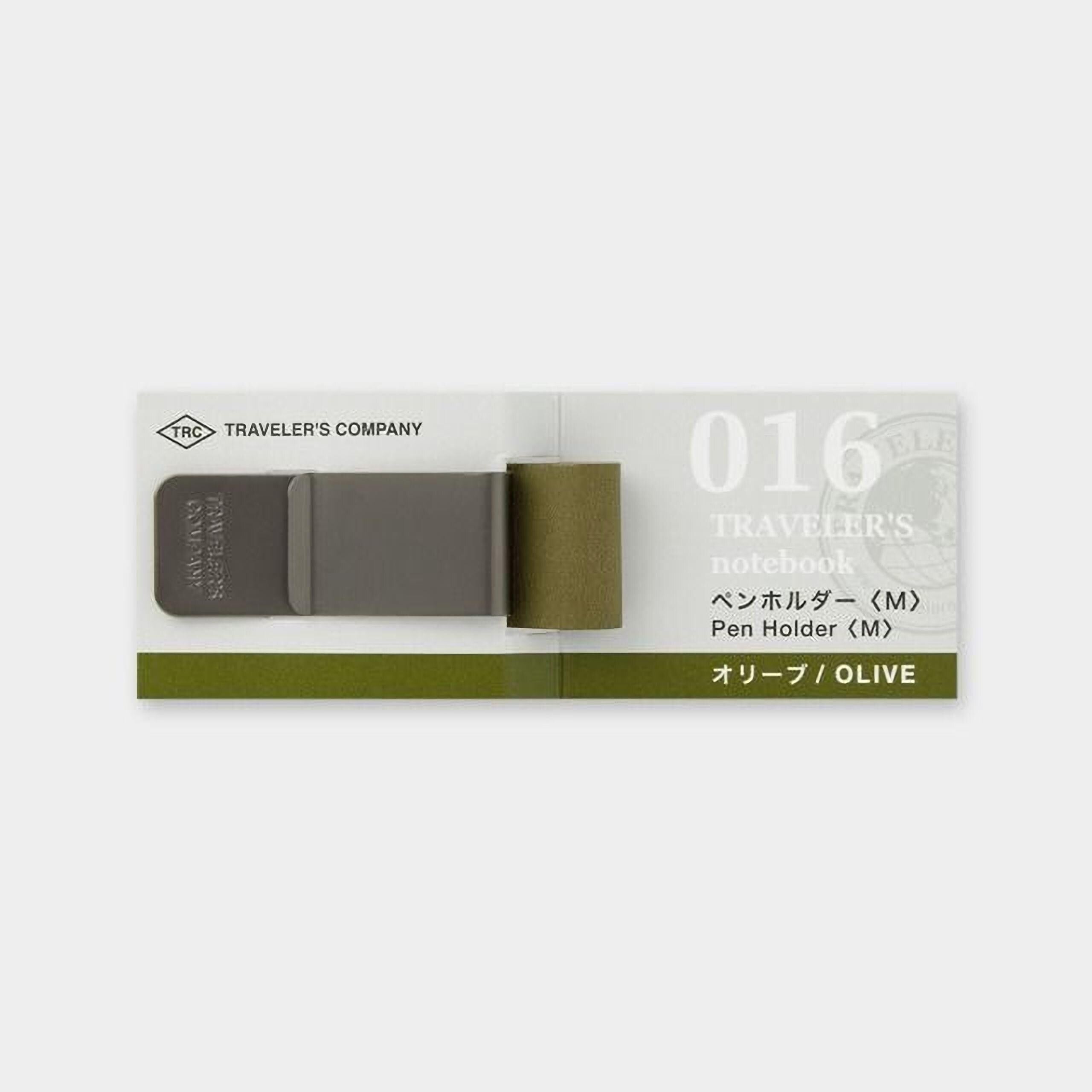 a grey and green pen holder with a green strap, designed for use with a notebook.