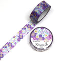 a roll of purple and white floral patterned washi tape and a round container of the same type of tape.