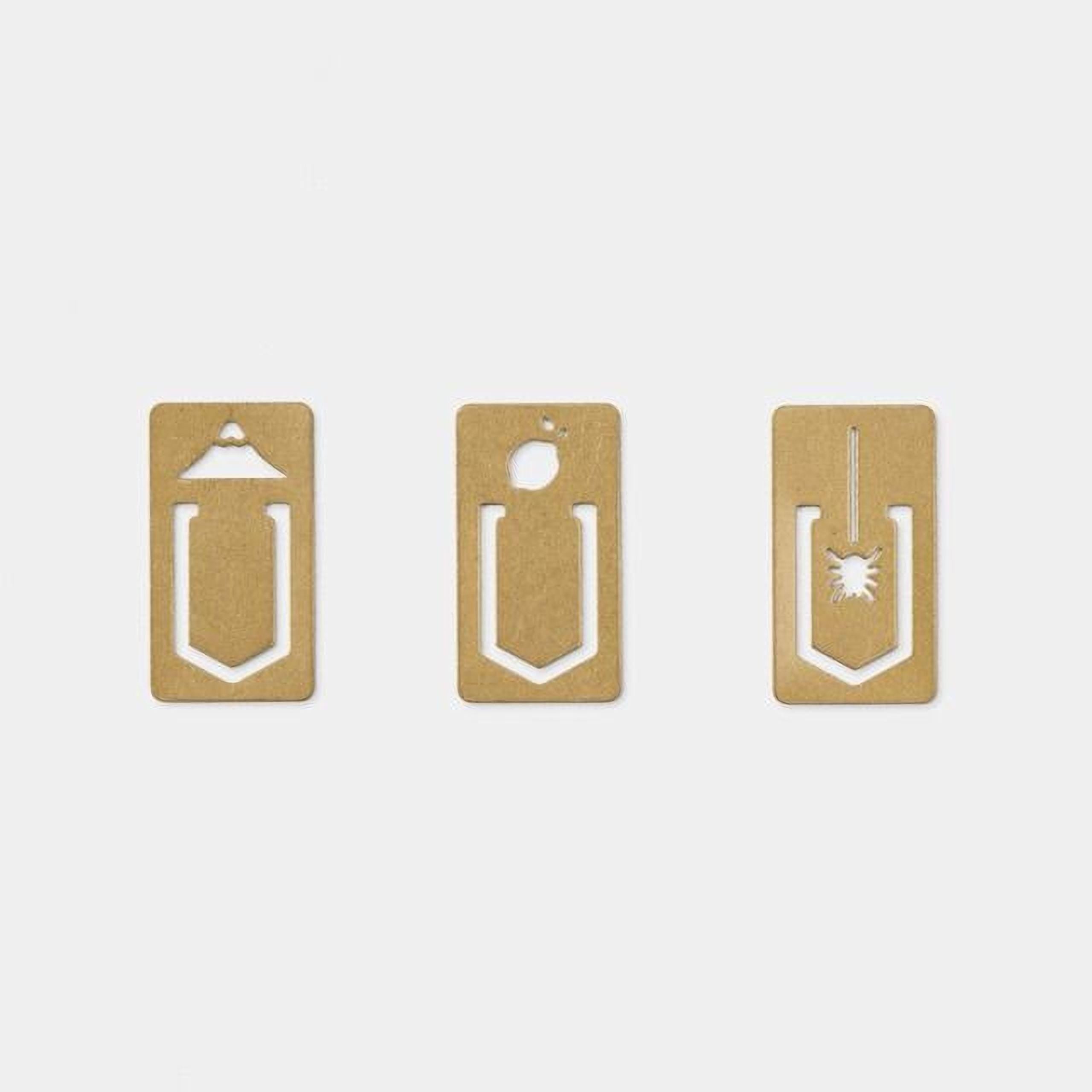 three identical gold-colored paper clips with unique designs, arranged in a row.