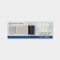 a blue and white notebook pen holder with a grey base, designed by TRAVELER'S COMPANY.