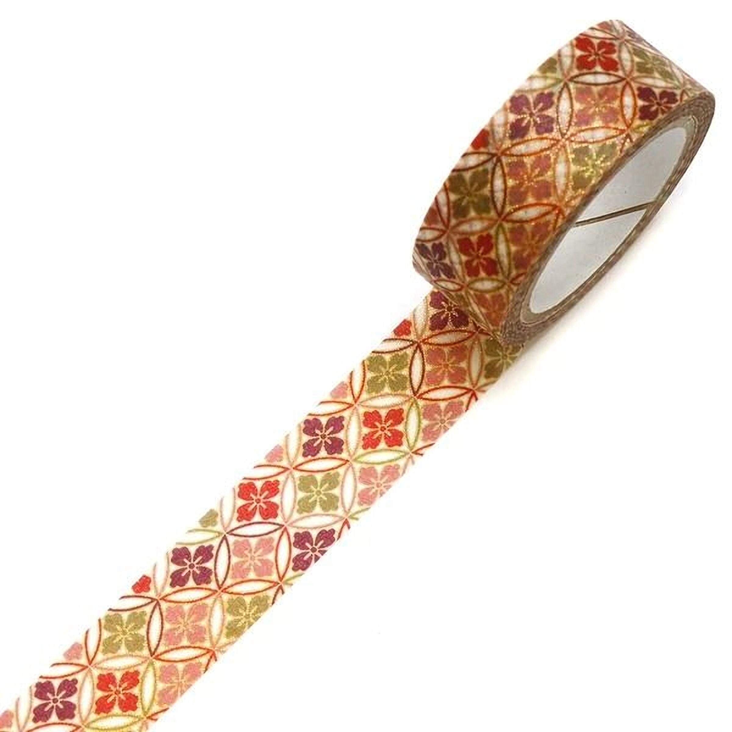 A roll of patterned tape with a repeating floral design in shades of red, orange, and yellow.
