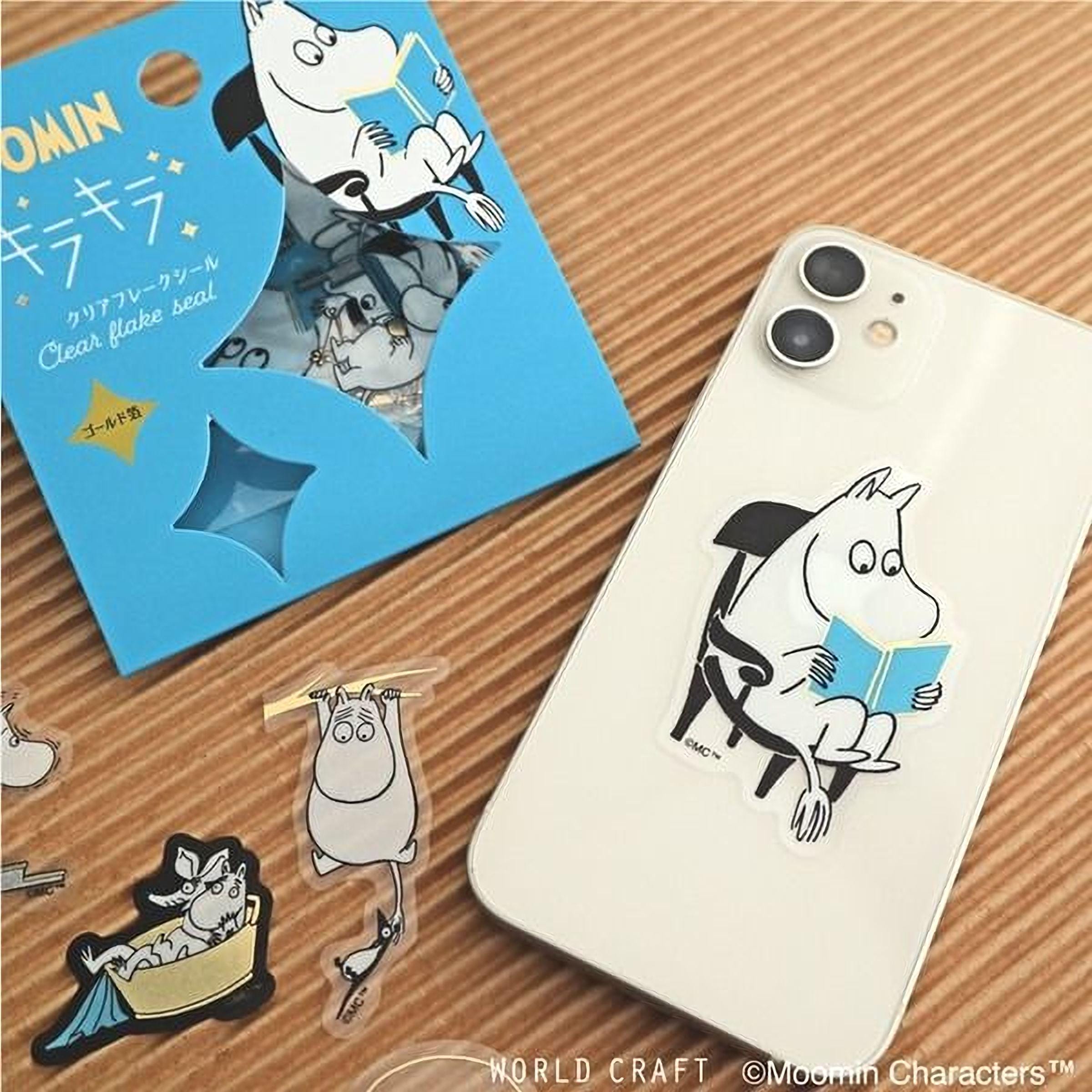 a collection of stickers and a phone case with a cartoon character, specifically Moomin, depicted on them.