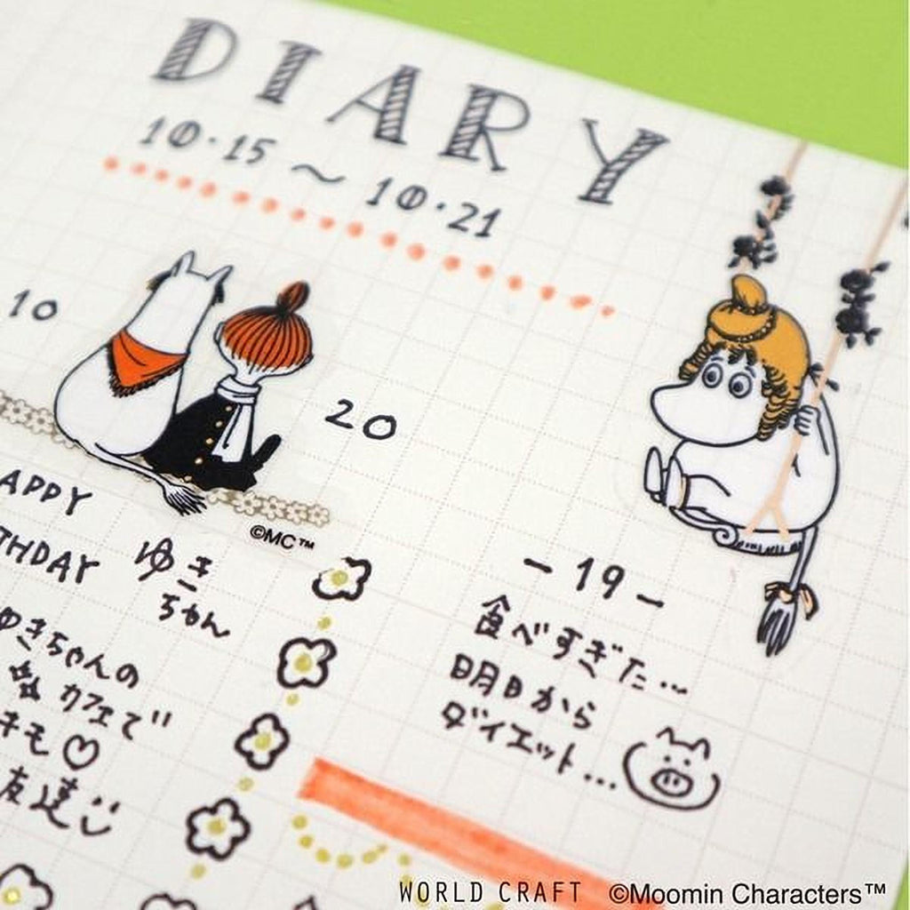 The image is a page from a diaries or planners, featuring illustrations of a cat, a girl, and a character, along with various dates and events written in different languages.