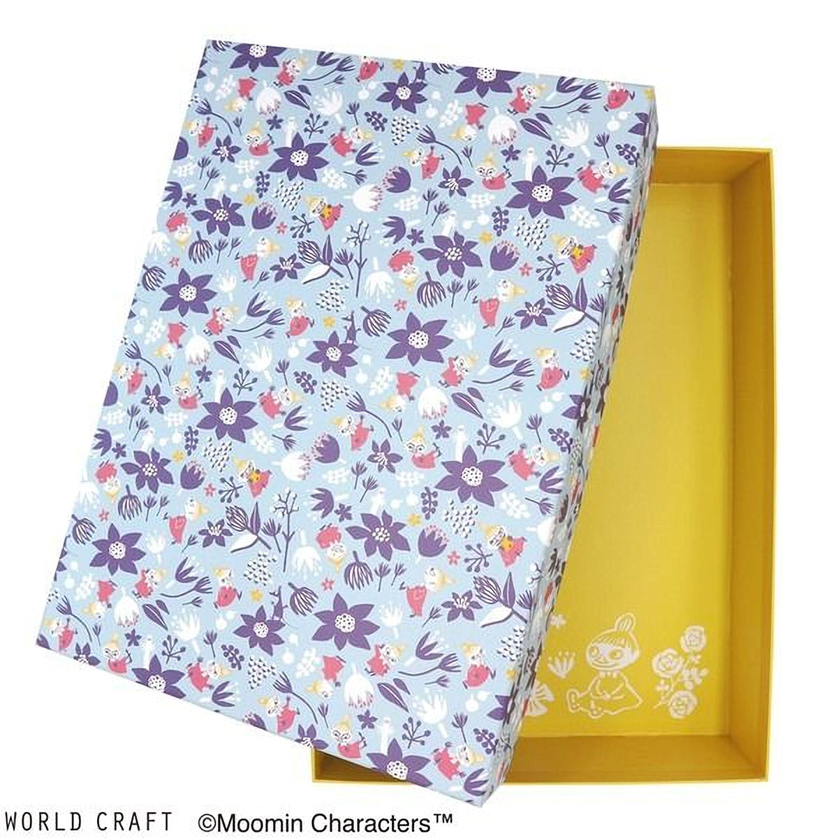 a box with a floral pattern and a yellow interior, with the lid of the box open.
