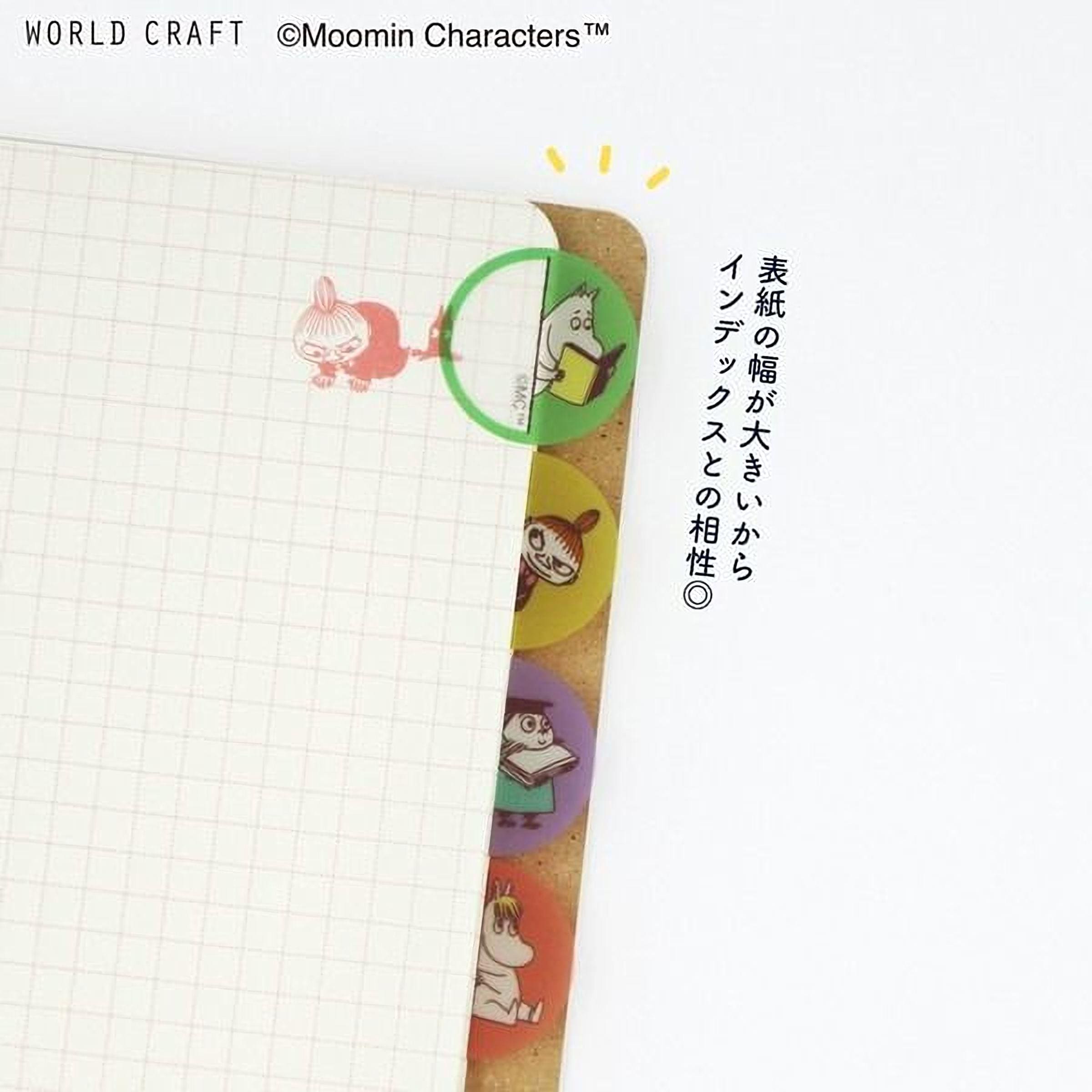 a notebook with a grid pattern and colorful stickers of cartoon characters on the right side.