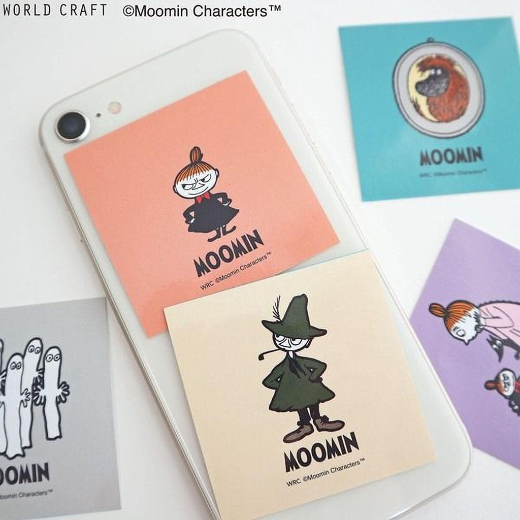 a smartphone with various stickers on it, including characters from the Moomin character series.