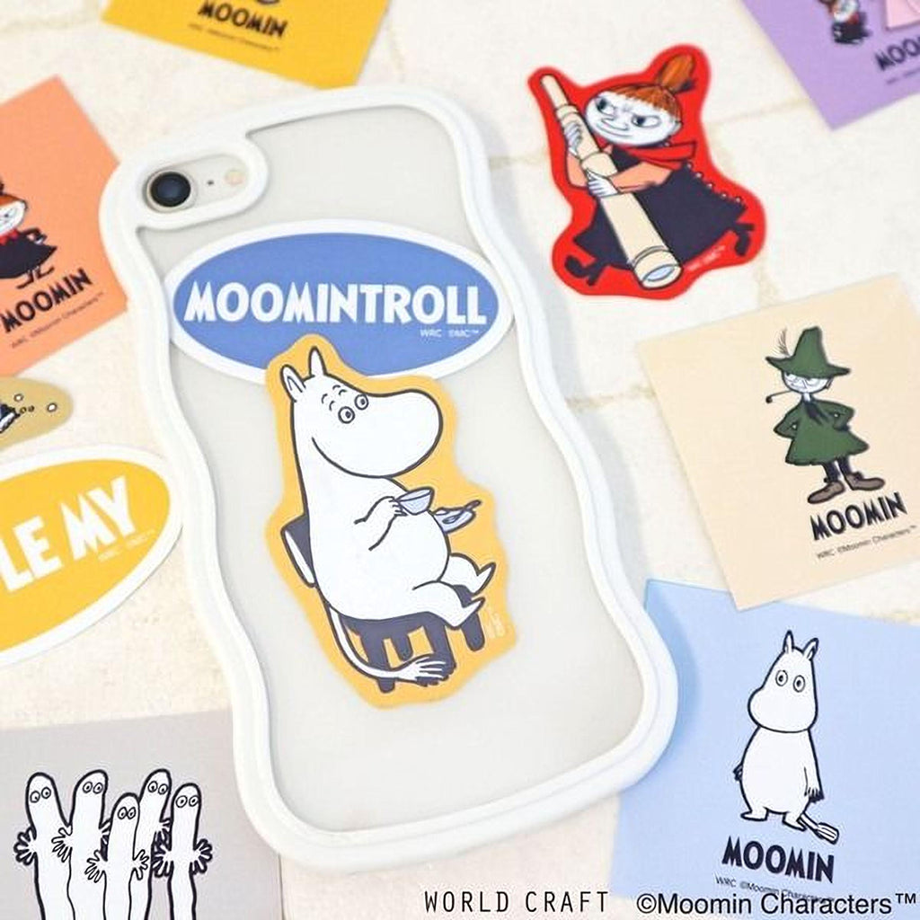 a phone case with a cartoon character sticker, surrounded by various stickers and illustrations related to the Moomin character.