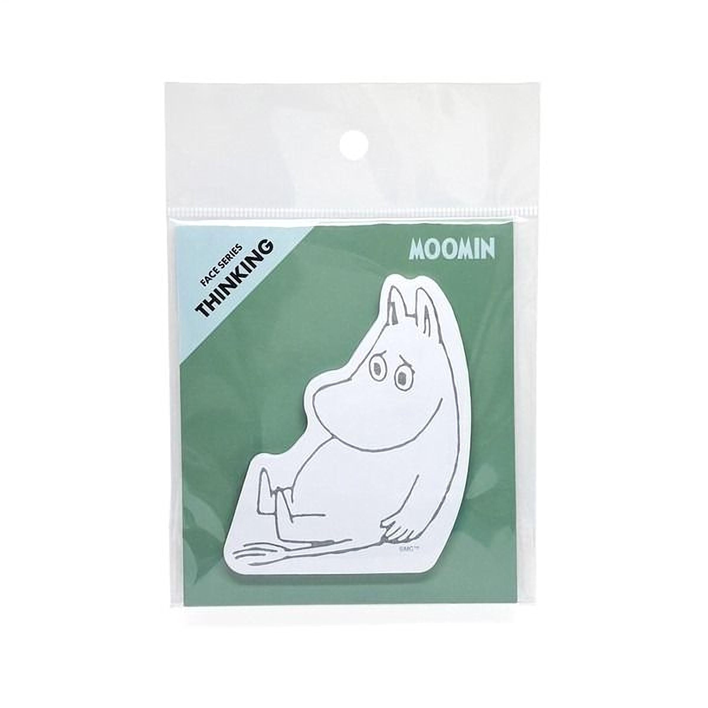 A sticker depicting a cartoon character, likely Moomin, sitting on a green background.