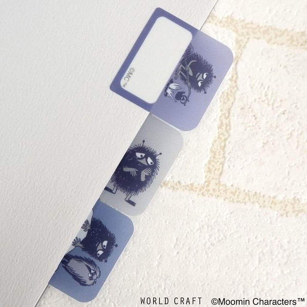 a collection of three colorful, cartoonish stickers or bookmarks with various animal designs, such as a cat, dog, and bird, placed on a white surface.