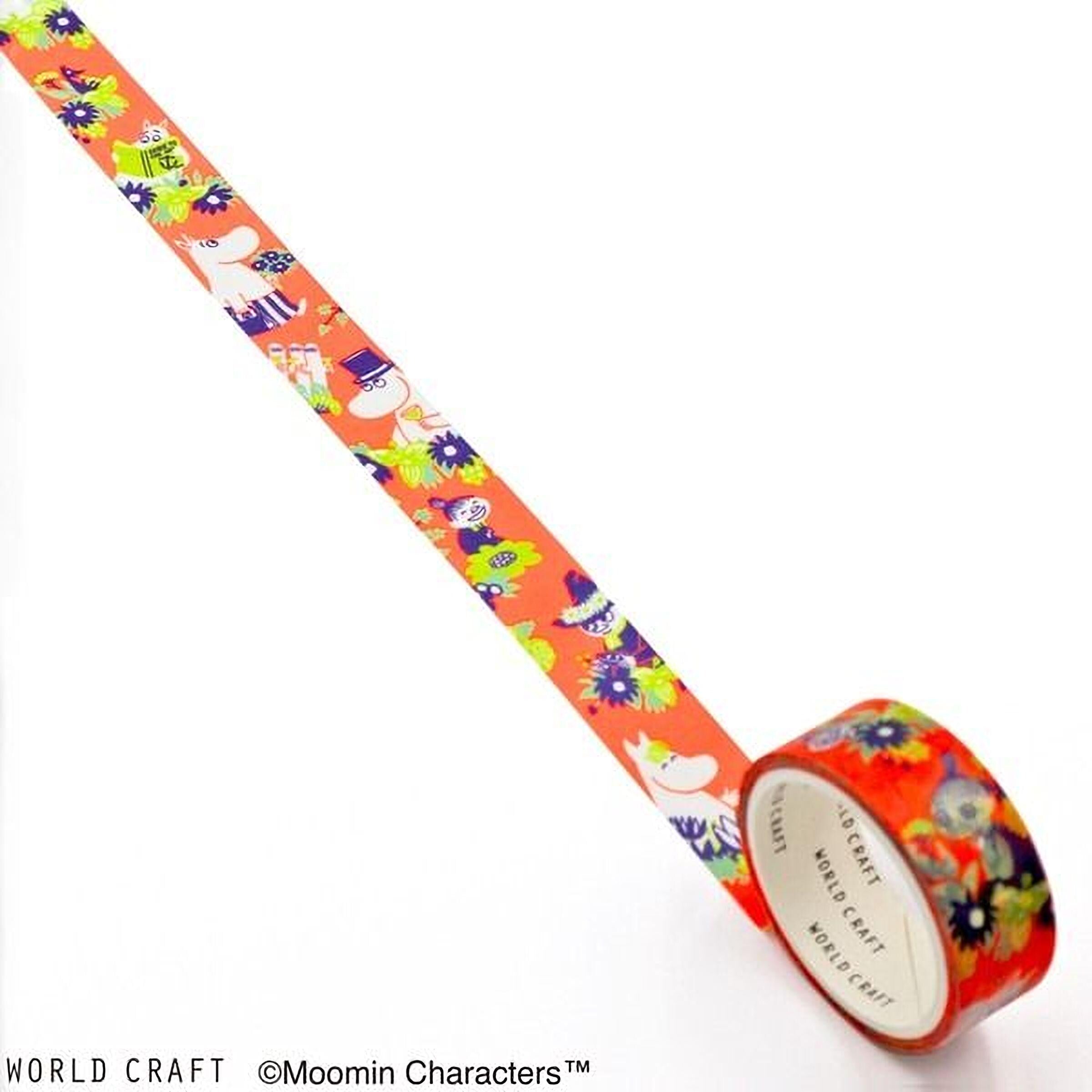 A roll of colorful, patterned tape with a Moomin character design on it, placed on a white surface.