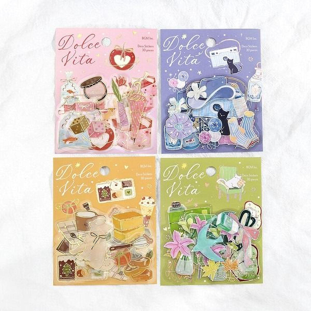 four colorful stickers with various illustrations and text, including the word "Dolce Vita" and other decorative elements.
