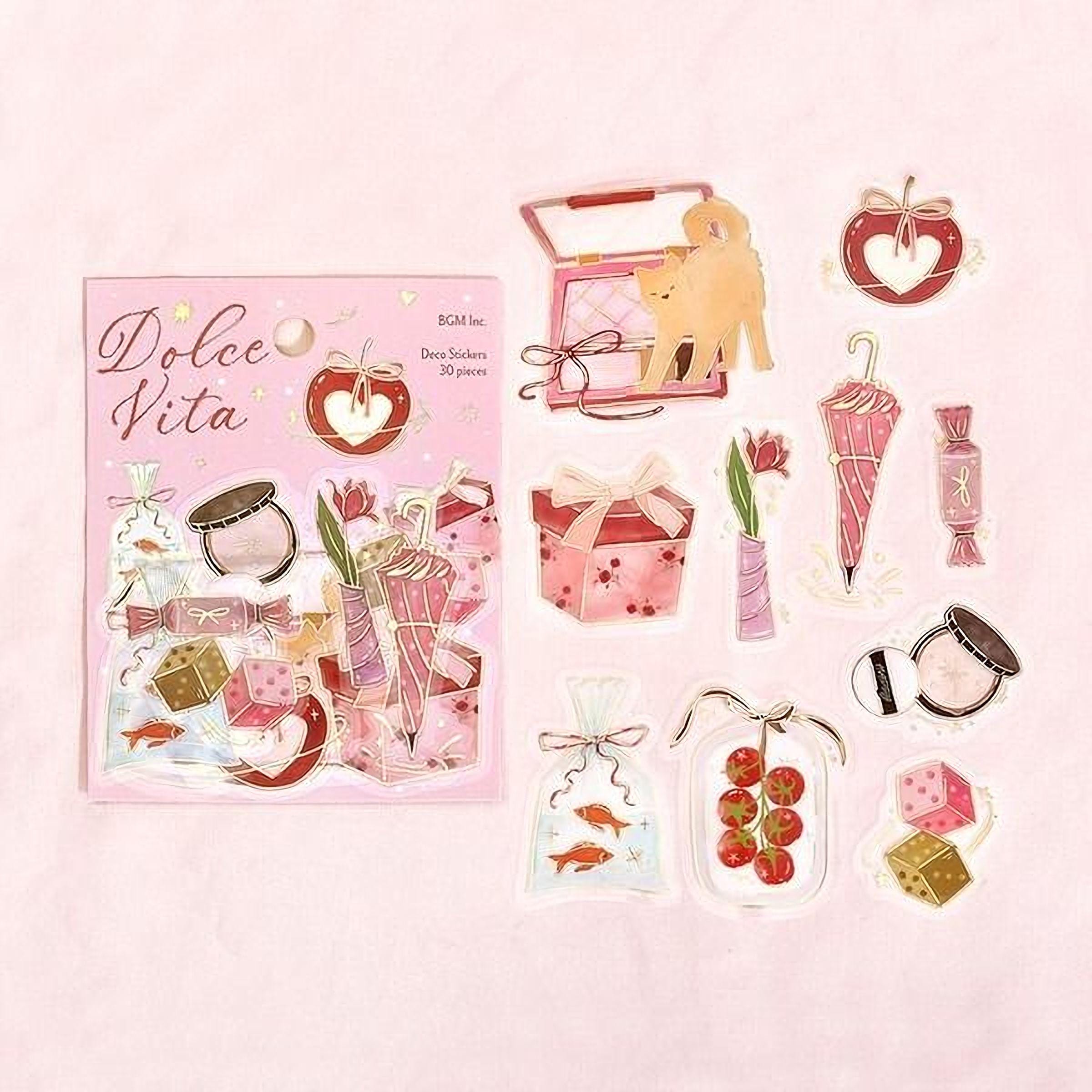 a pink background with a bunch of stickers on it