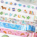 a variety of colorful and patterned tape rolls, each with different designs and illustrations, including stars, hearts, and other decorative elements.