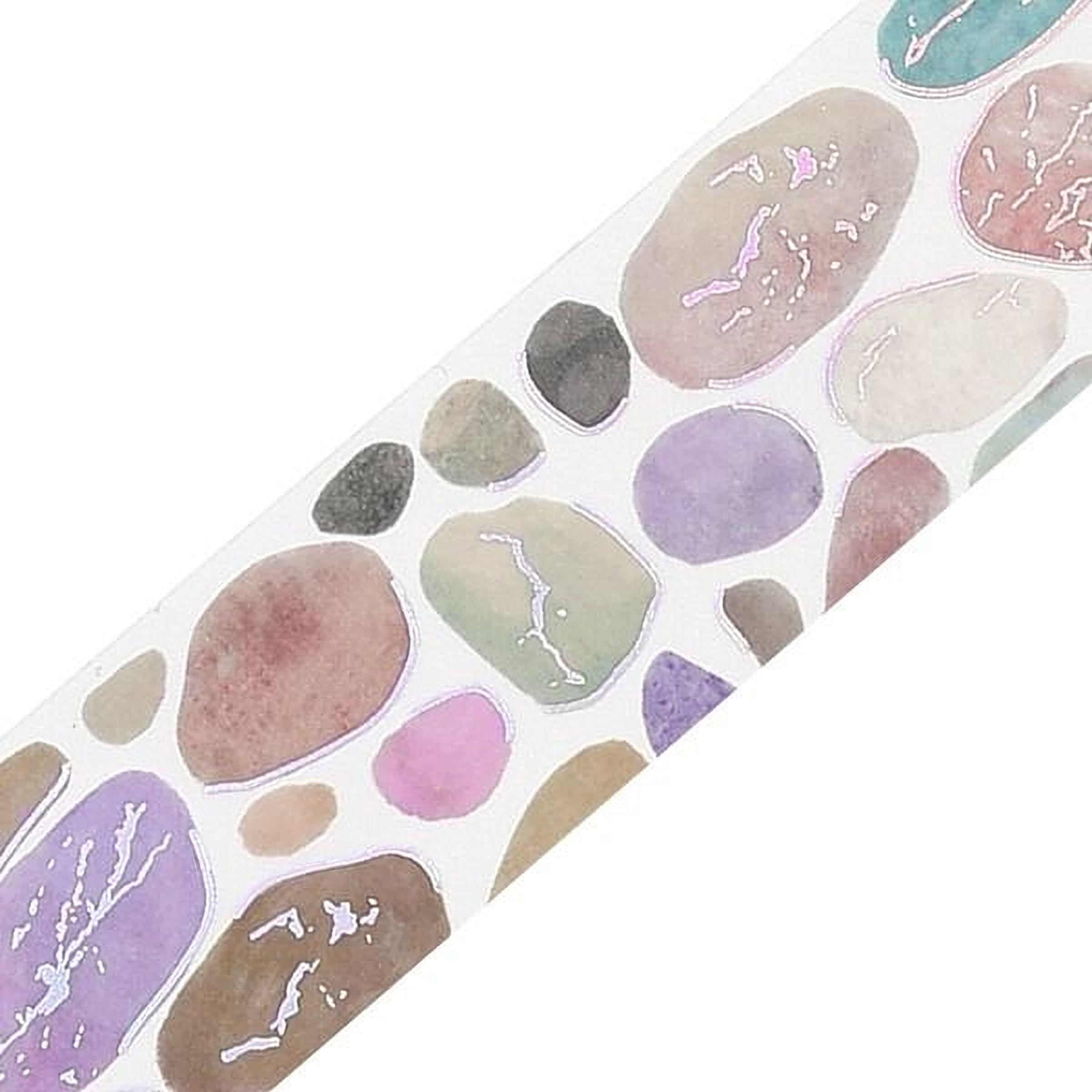 a variety of colorful rocks and stones, including shades of pink, purple, green, and brown, arranged in a visually appealing pattern.
