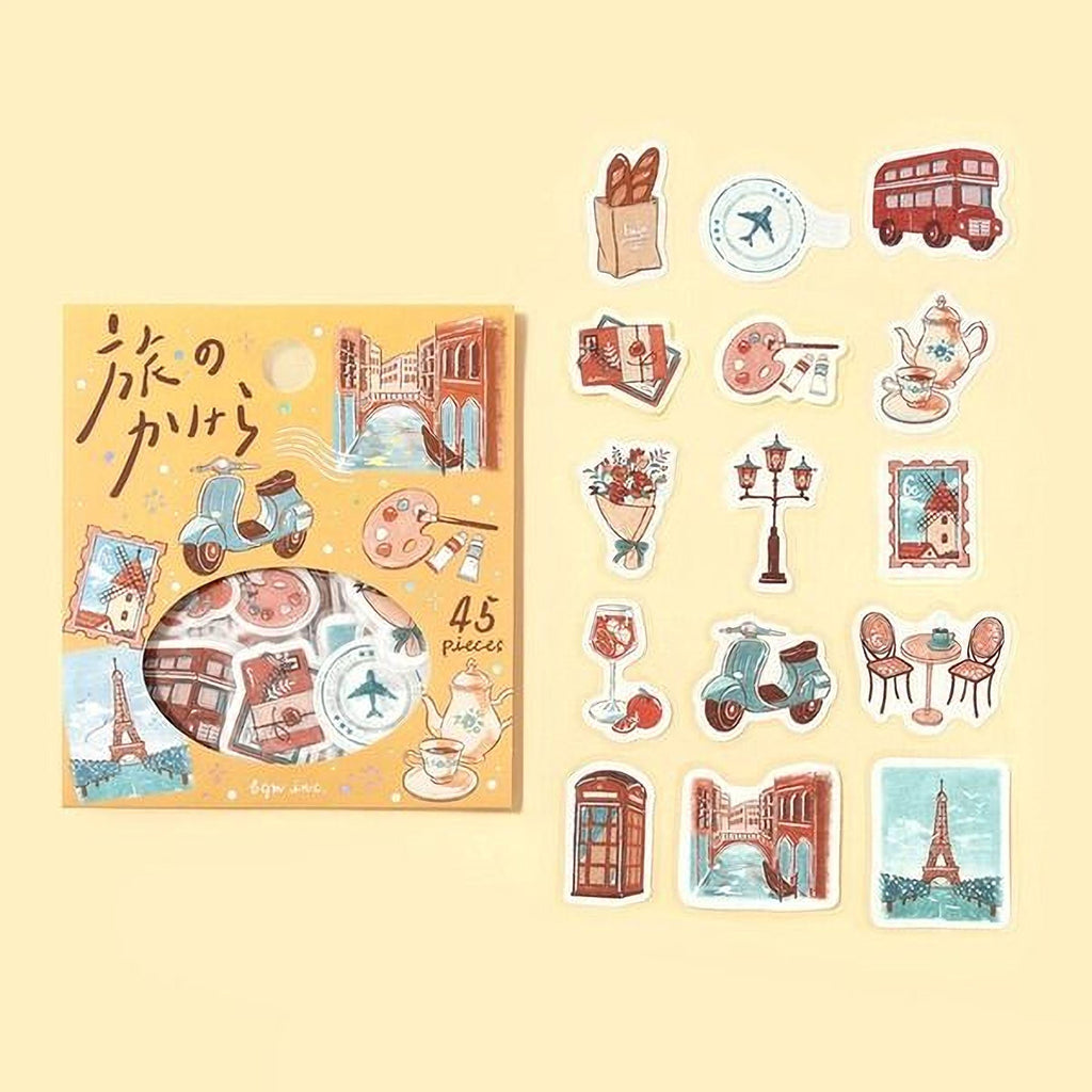 a collection of colorful stickers depicting various scenes and objects, such as a double-decker bus, a teapot, a bicycle, and a clock.