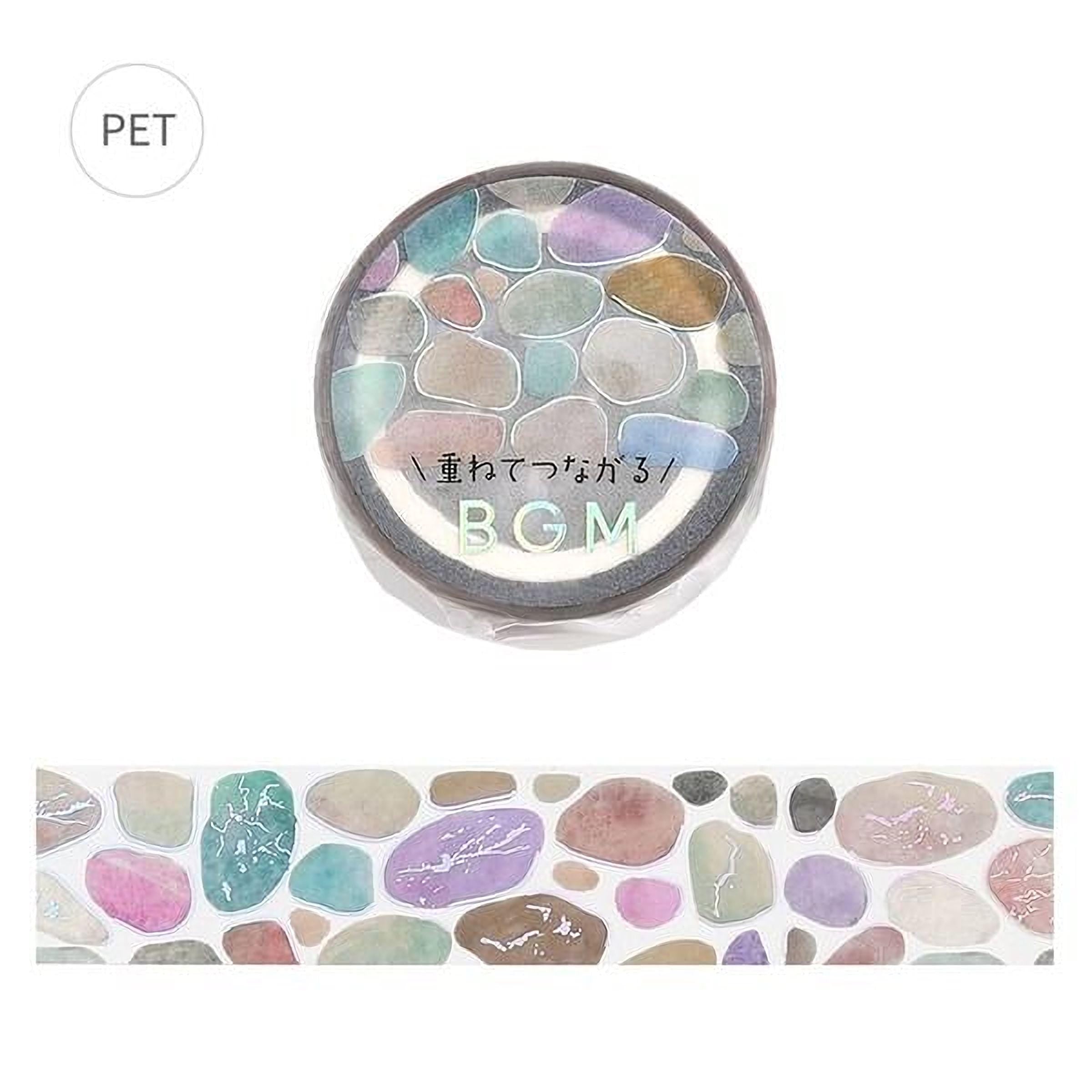 a circular object with a colorful, abstract design of various colored stones or pebbles, and the text "BGM" written on it.