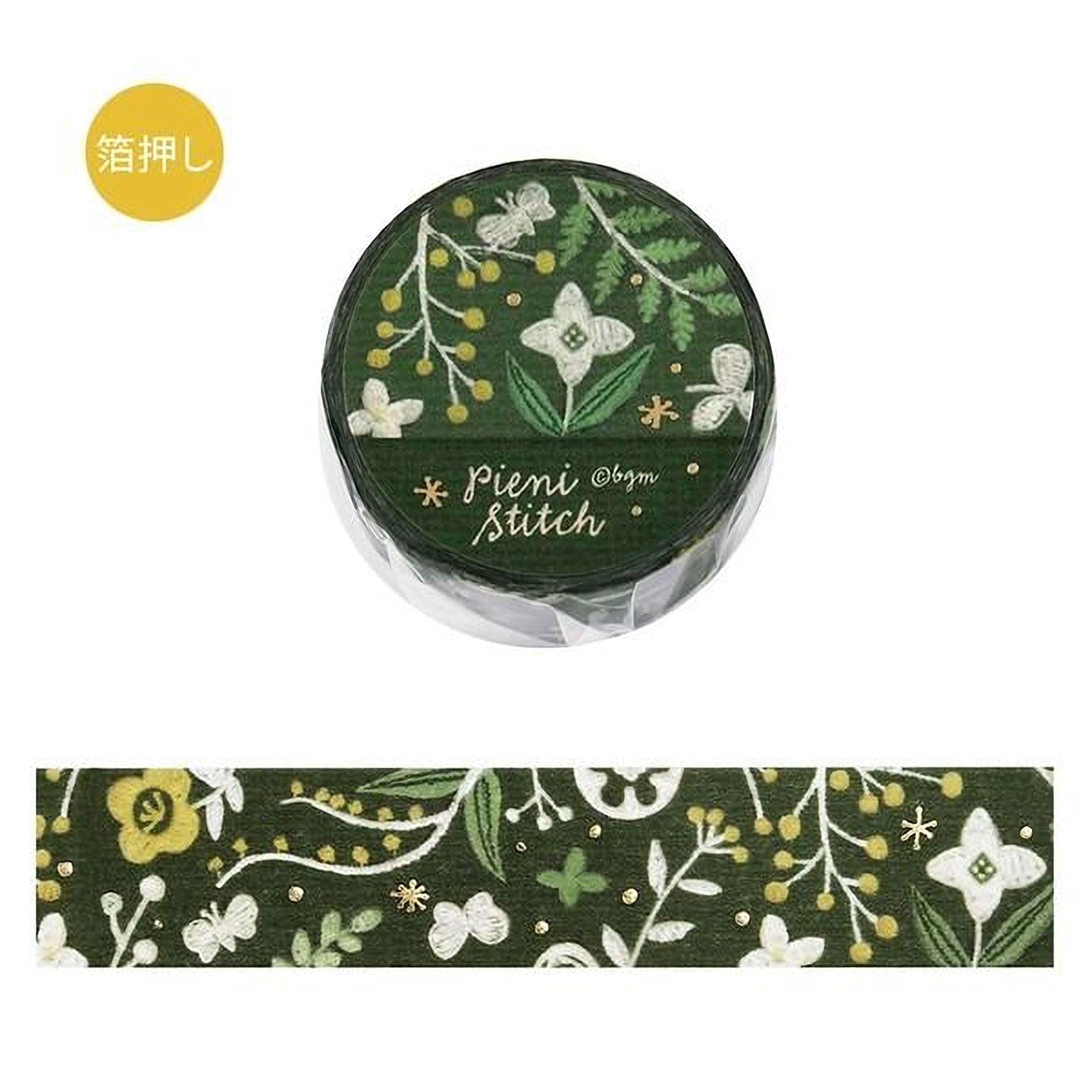 a green and white floral pattern on a round object, which appears to be a piece of paper or a decorative item. The object has a floral design with leaves, flowers, and branches, and the text "Pier Stitch" is written on it.