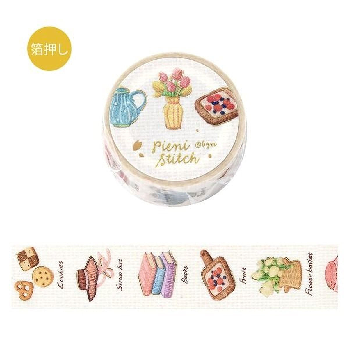 a round, white, and gold-colored round object with various embroidered illustrations on it, including a vase with flowers, a cup, a sandwich, and other food items.