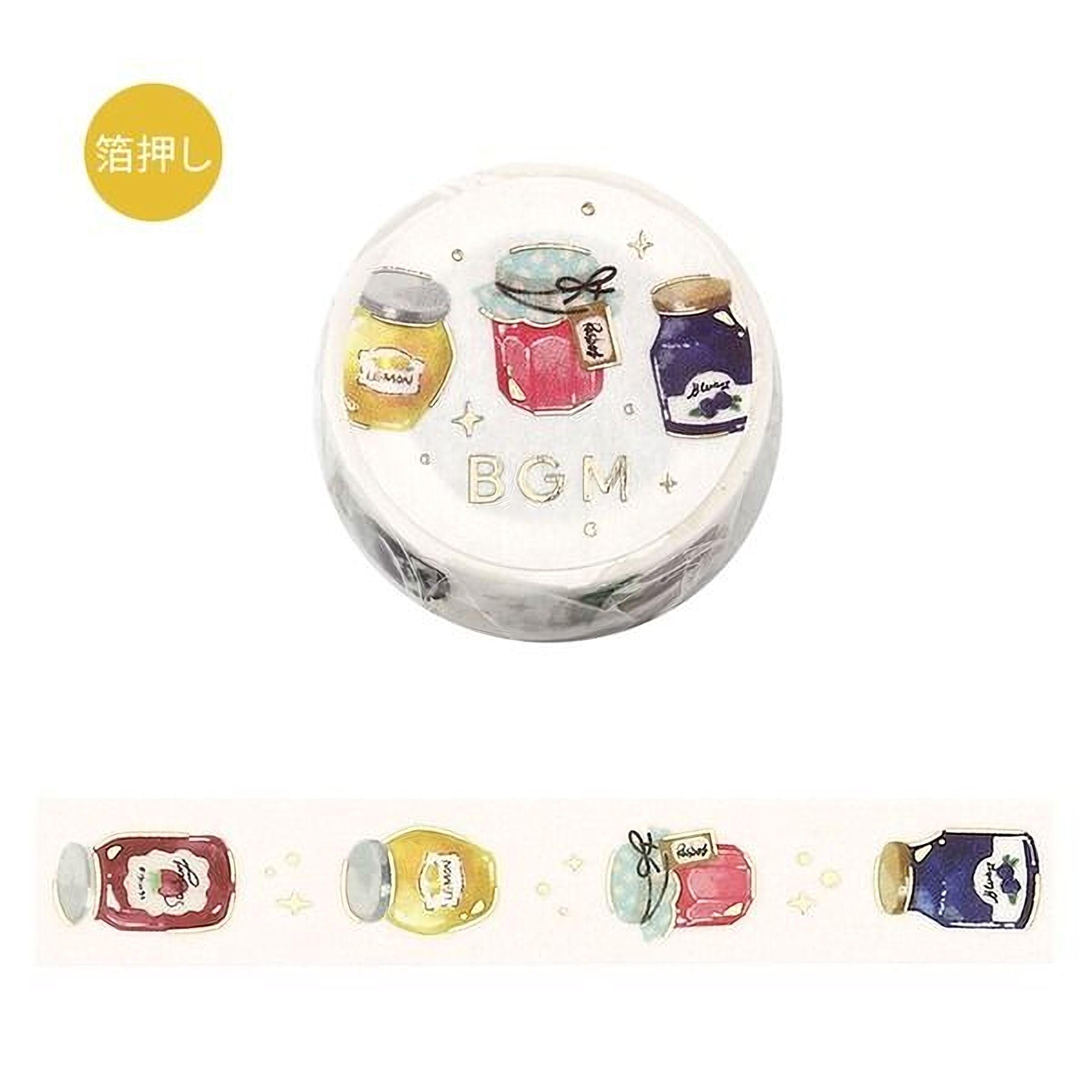 a round, white, and gold-colored object with illustrations of various jars and containers, including a jar of jam, a jar of jelly, and a jar of pickles.