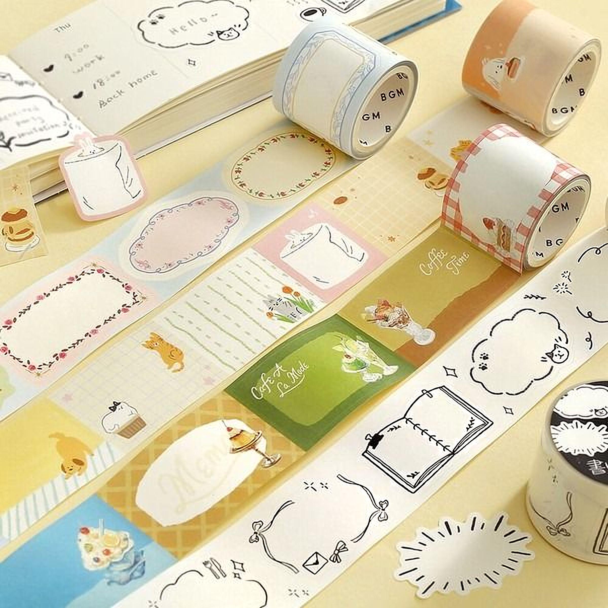 various colorful and patterned washi tape rolls, some of which have illustrations of food items and other decorative elements.