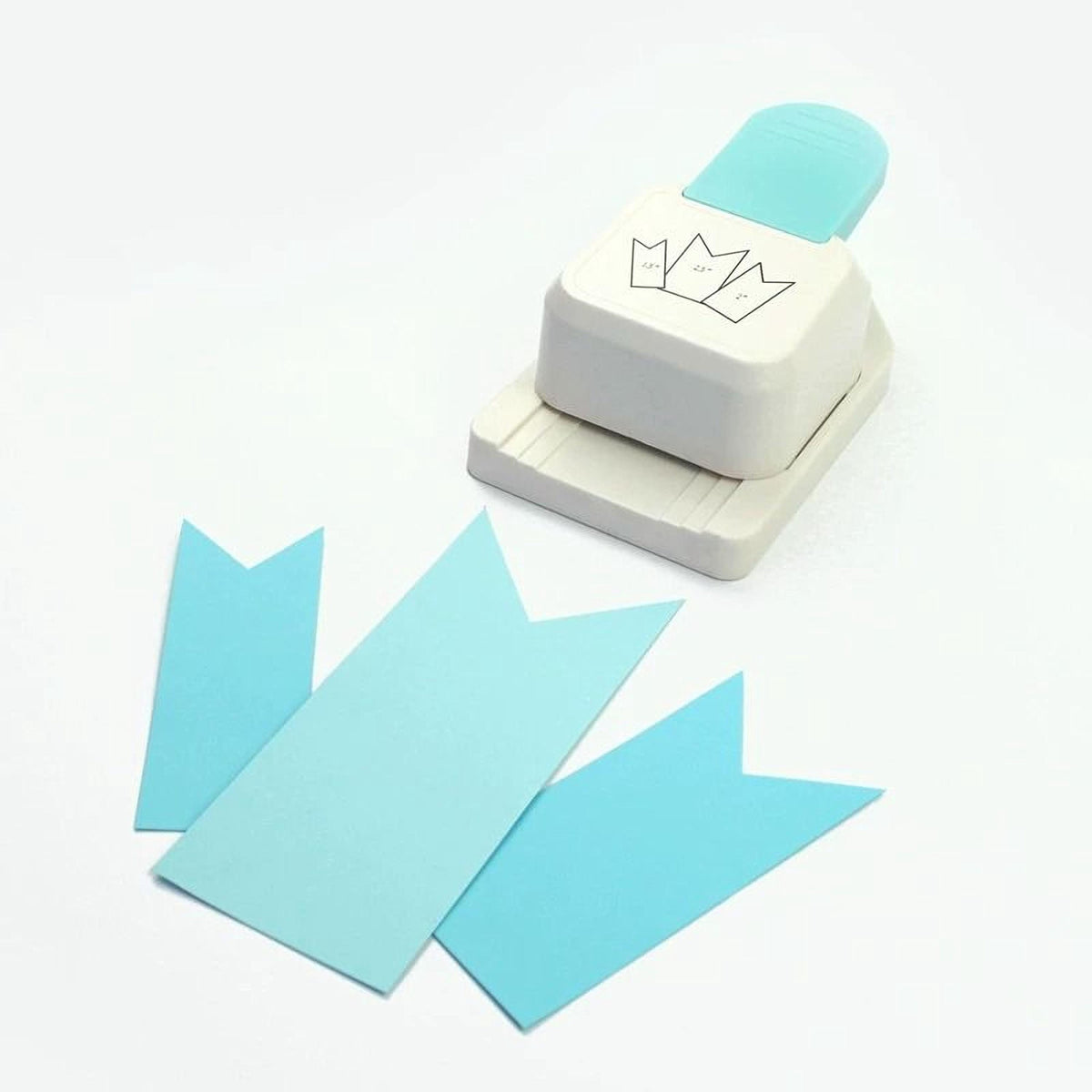a white and blue paper punch with a blue handle, and there are several blue paper pieces on the white background.